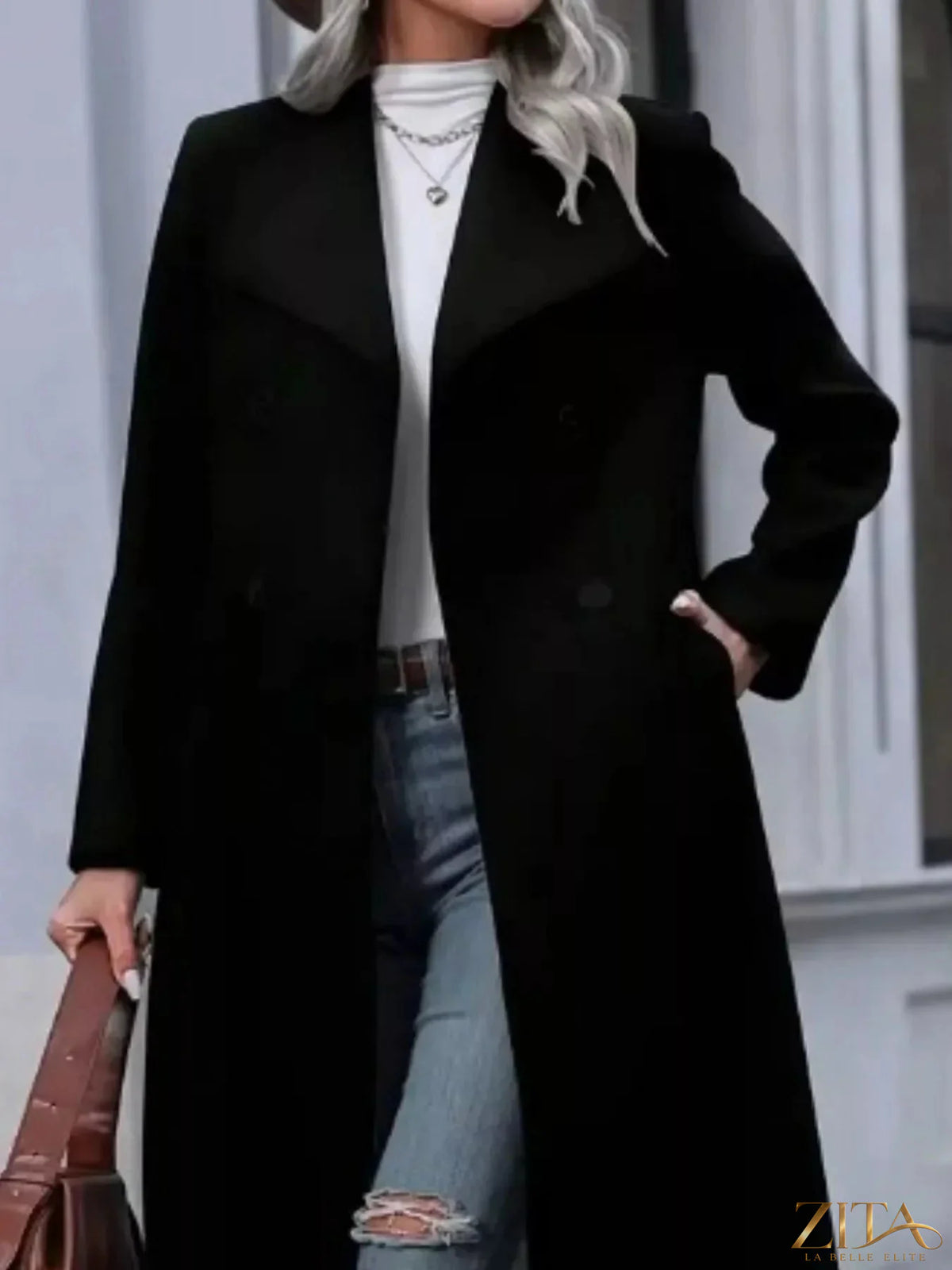 Zita La Belle Elite double-breasted longline overcoat in neutral fabric, displayed on a hanger with a tailored fit and classic lapels.