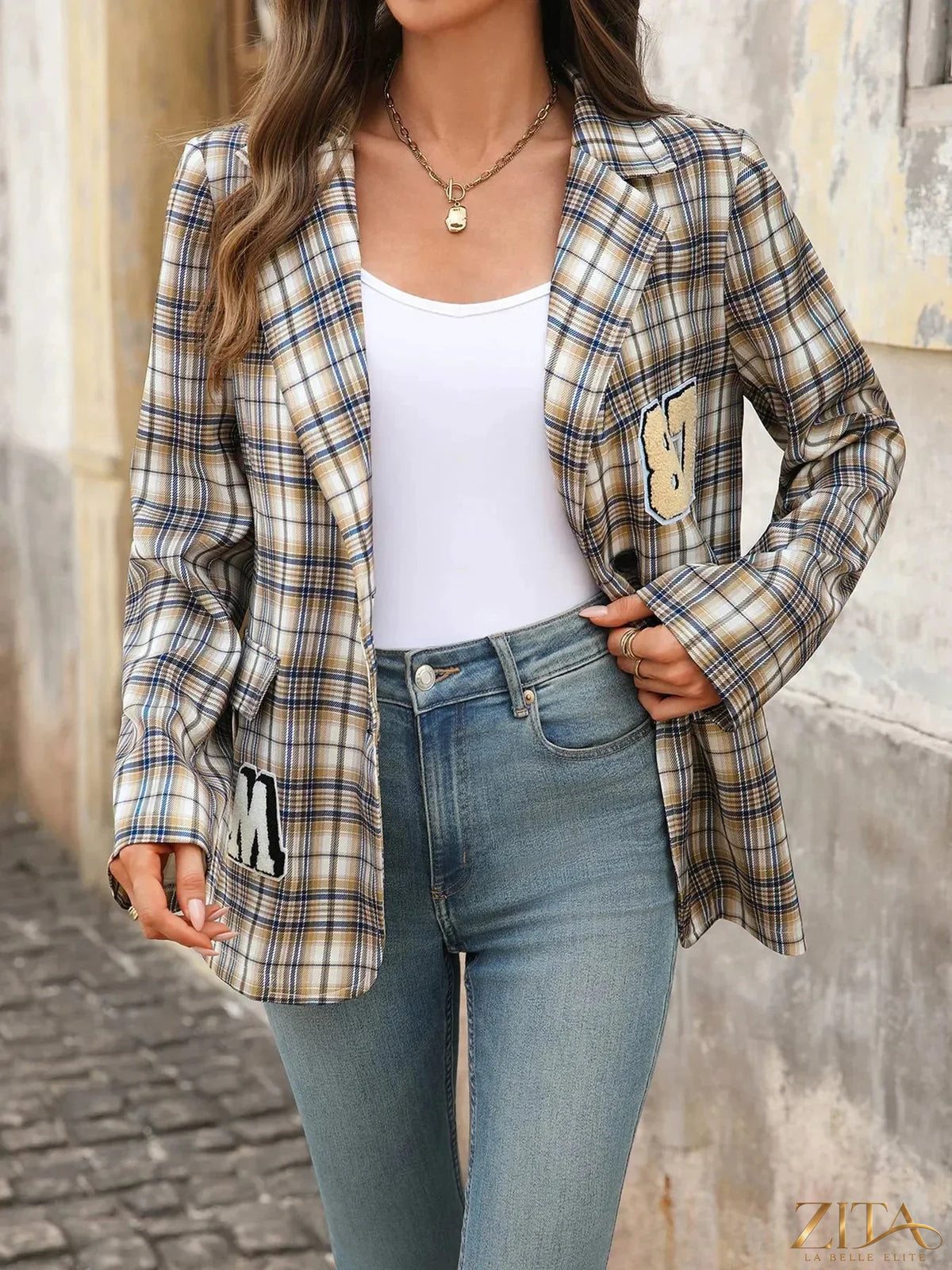 Zita La Belle Elite Number 87 plaid long sleeve blazer shown on a hanger, featuring a classic checkered pattern and tailored fit.