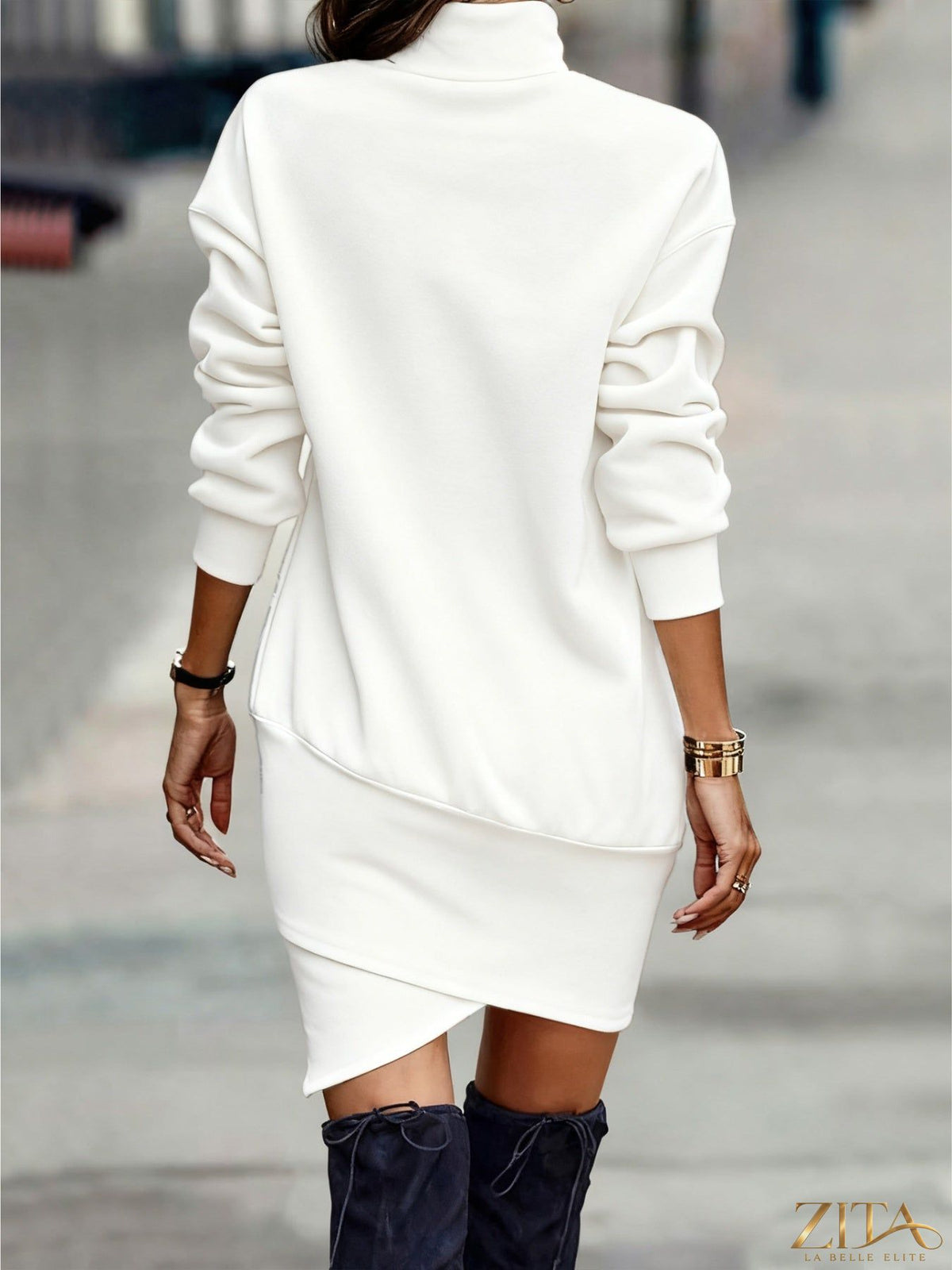 Black turtleneck long sleeve asymmetrical hem mini dress by Trendsi, shown on a model with a fitted silhouette and stylish design.