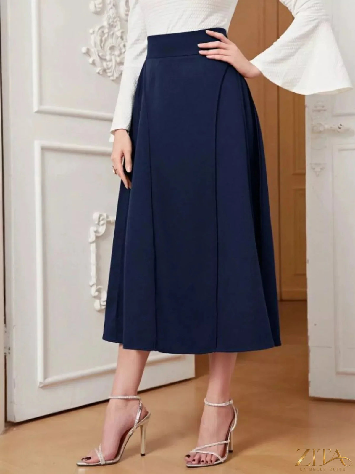 A-line midi skirt by Trendsi featuring a flowing design, high waist, and elegant silhouette in soft fabric.