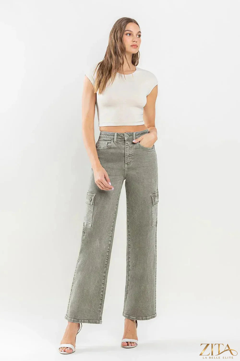 Vervet by Flying Monkey 90s super high-rise cargo jeans in light denim with multiple pockets and relaxed fit.