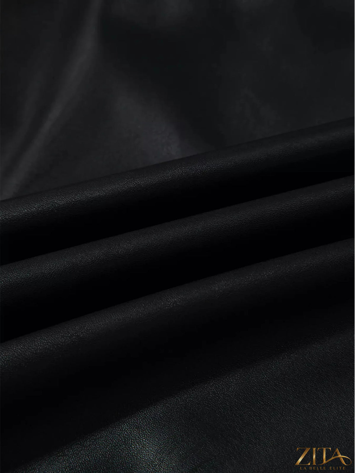 Vegan leather sleeveless mini dress by Zita La Belle Elite, fitted design with a stylish neckline, shown on a mannequin.