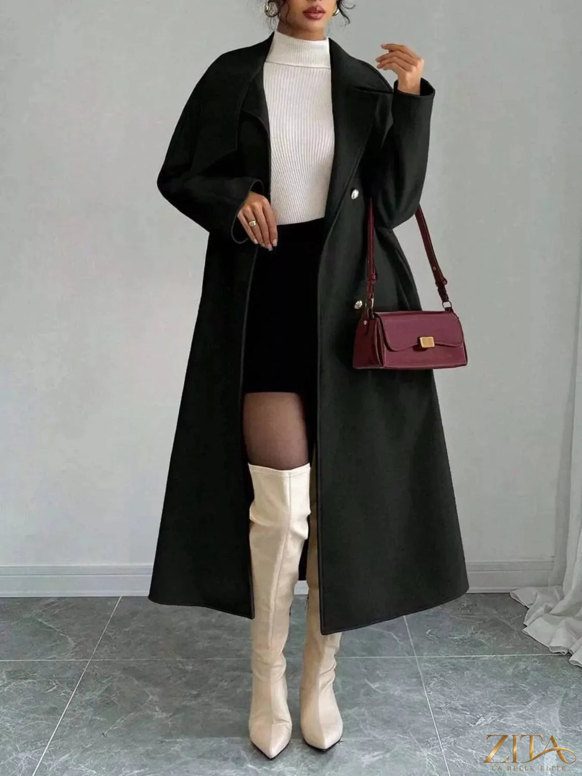 Zita La Belle Elite double-breasted longline coat in neutral fabric, styled with lapels and buttons for a sophisticated look.