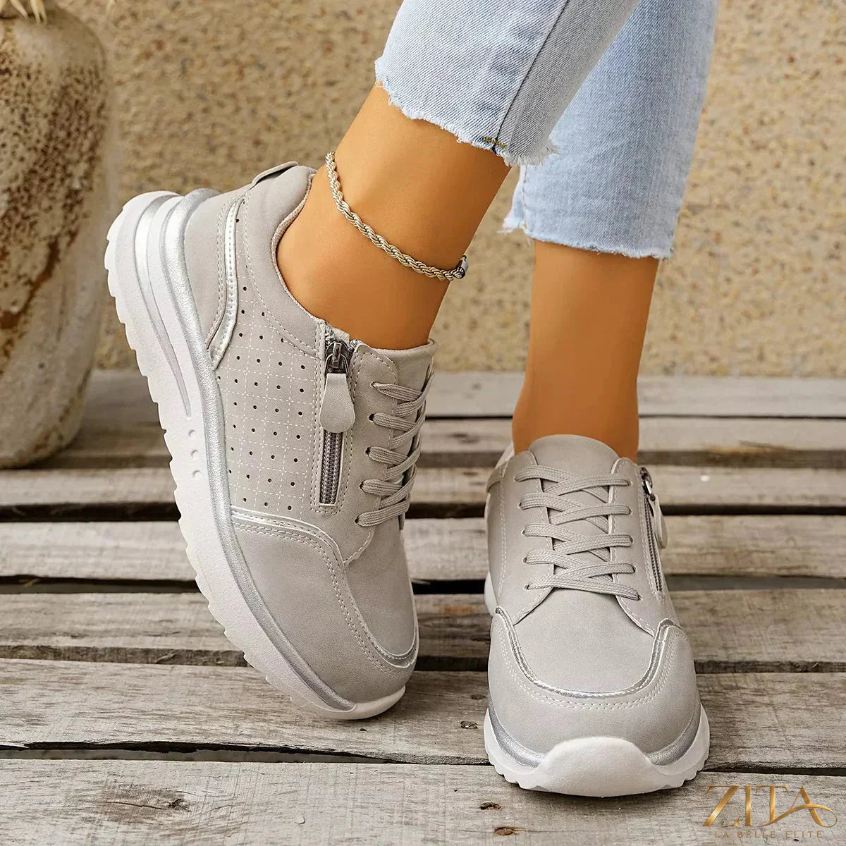 Zita La Belle Elite round toe lace-up sneakers in white with cushioned soles and stylish design on smooth leather material.