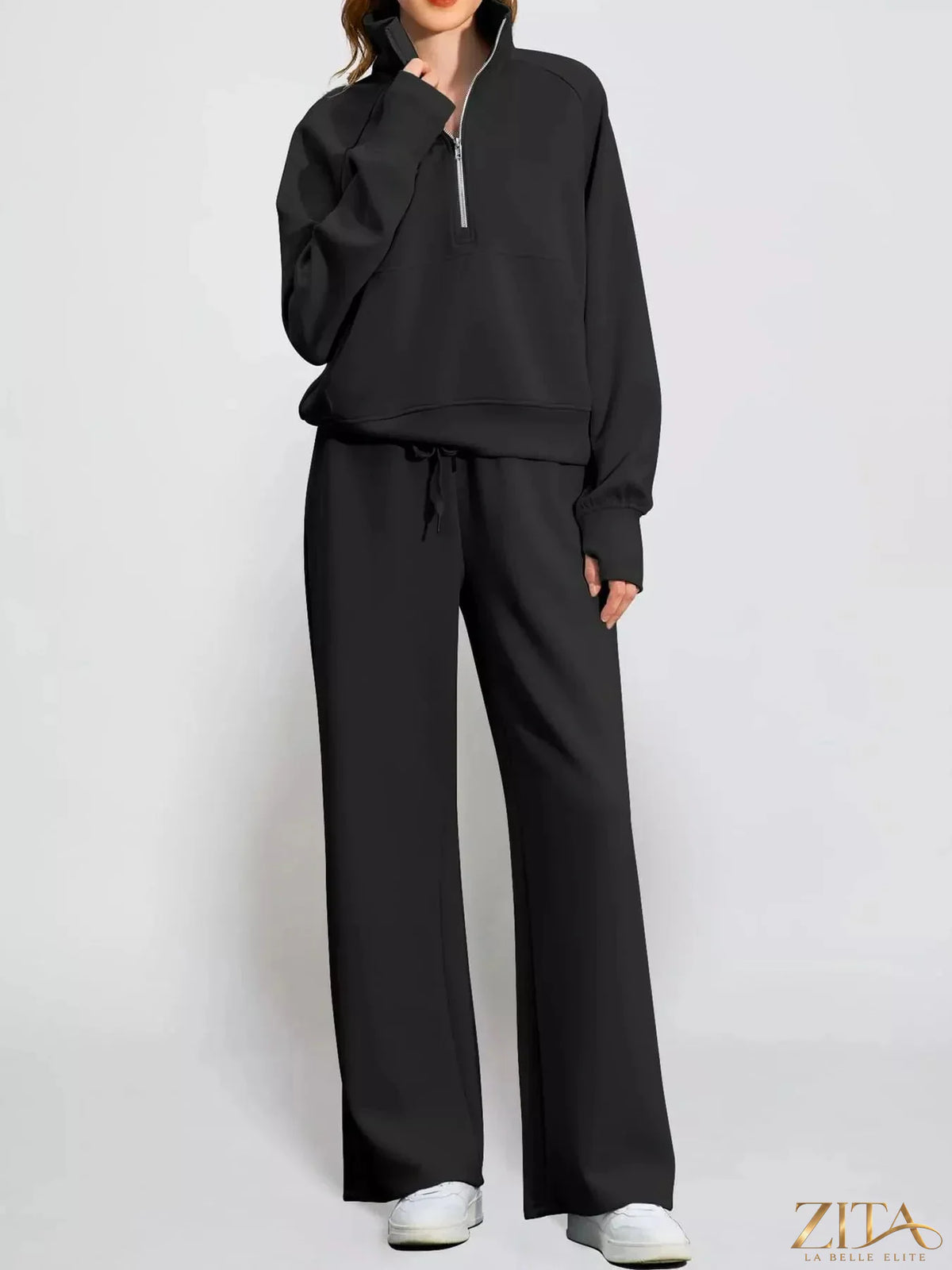 Zita La Belle Elite half-zip sweatshirt and wide-leg pants set displayed on a hanger, showcasing the casual loungewear style.
