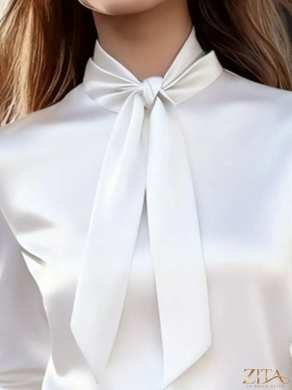 Zita La Belle Elite satin bow tie long sleeve blouse featuring a front bow detail and elegant design.