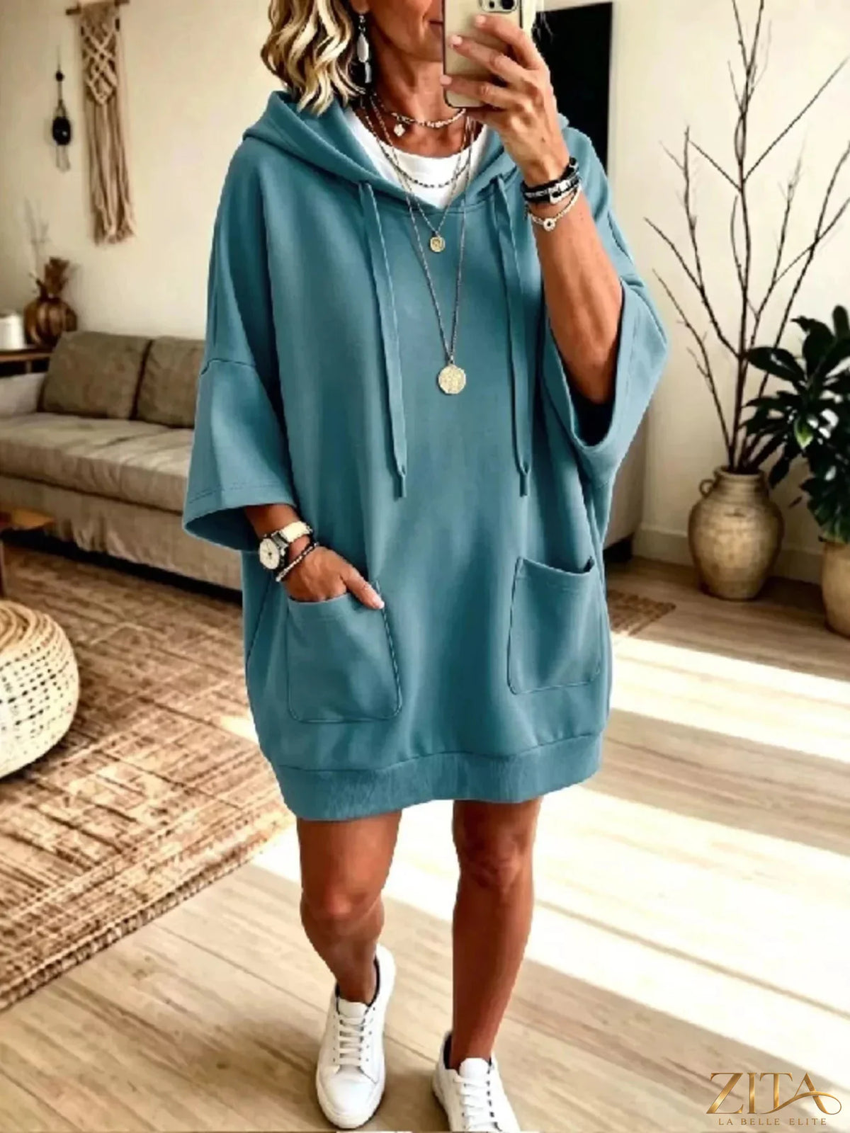 Plus size oversized drawstring hoodie with front pockets by Zita La Belle Elite, showing the relaxed fit and cozy design.