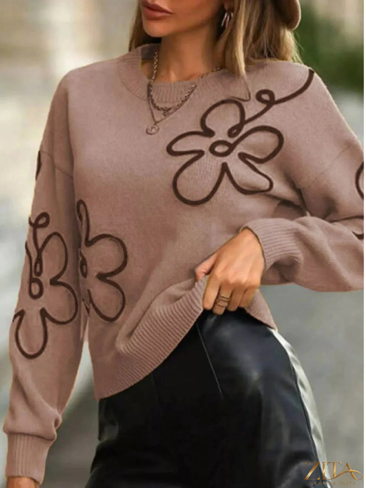 Flower dropped shoulder sweater by Trendsi featuring a floral pattern and relaxed fit, shown in a soft, cozy fabric.