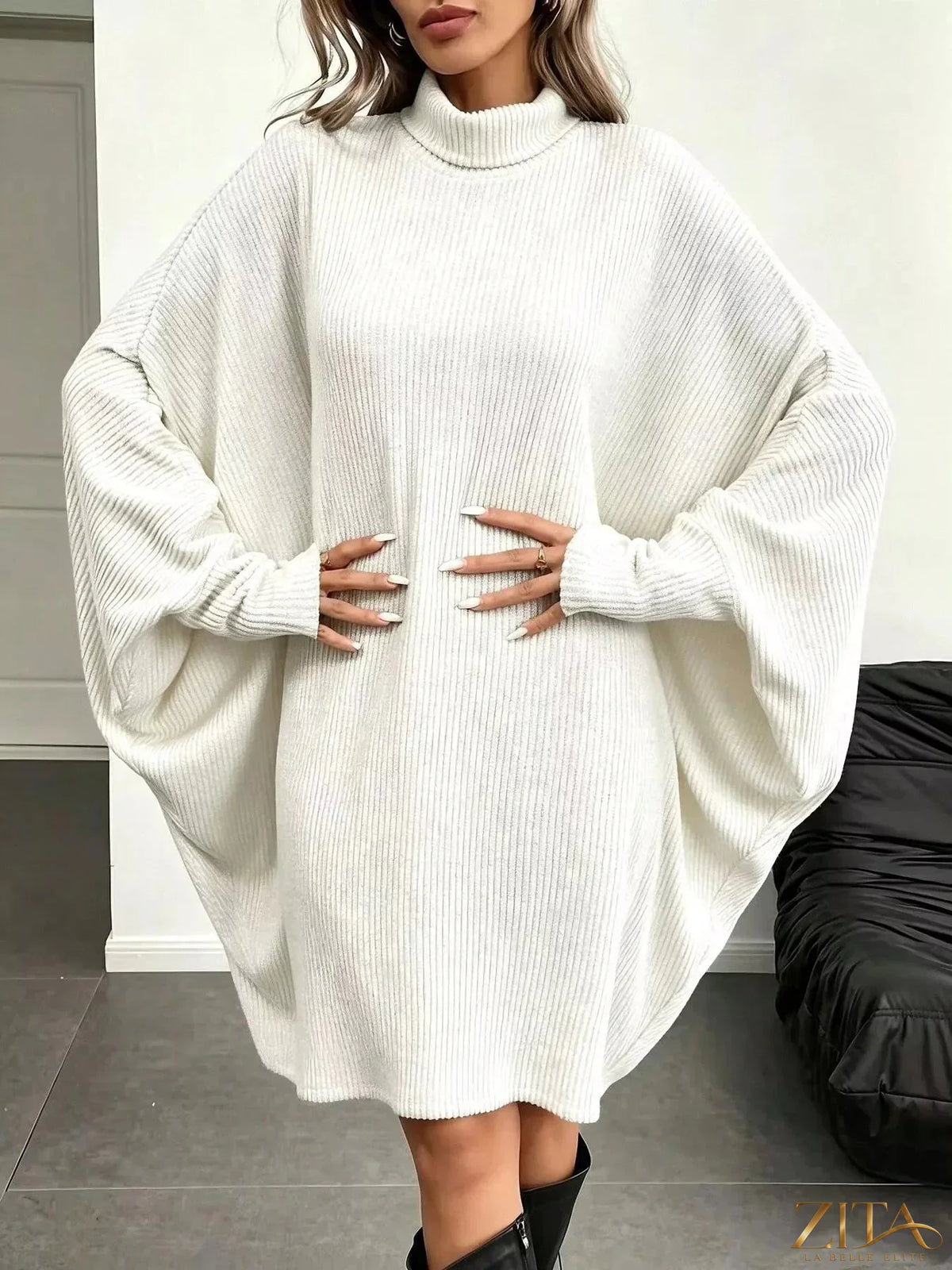 Zita La Belle Elite oversized batwing sleeve ribbed knit turtleneck dress, showcasing its relaxed fit and cozy fabric.