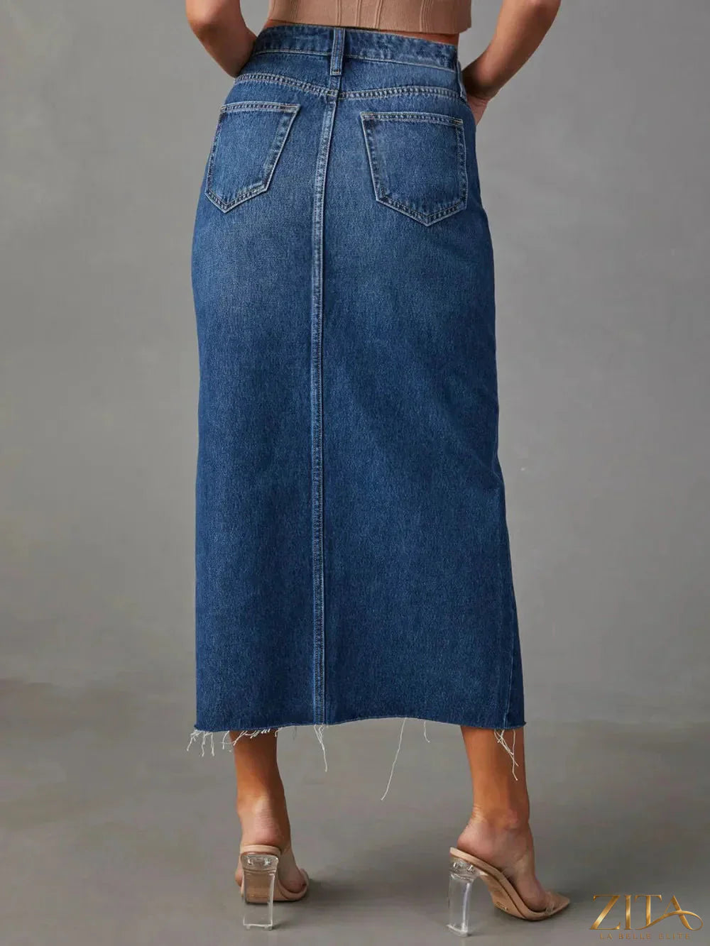 Zita La Belle Elite raw hem front slit denim midi skirt shown with a high waist and distressed detailing, styled for casual wear.