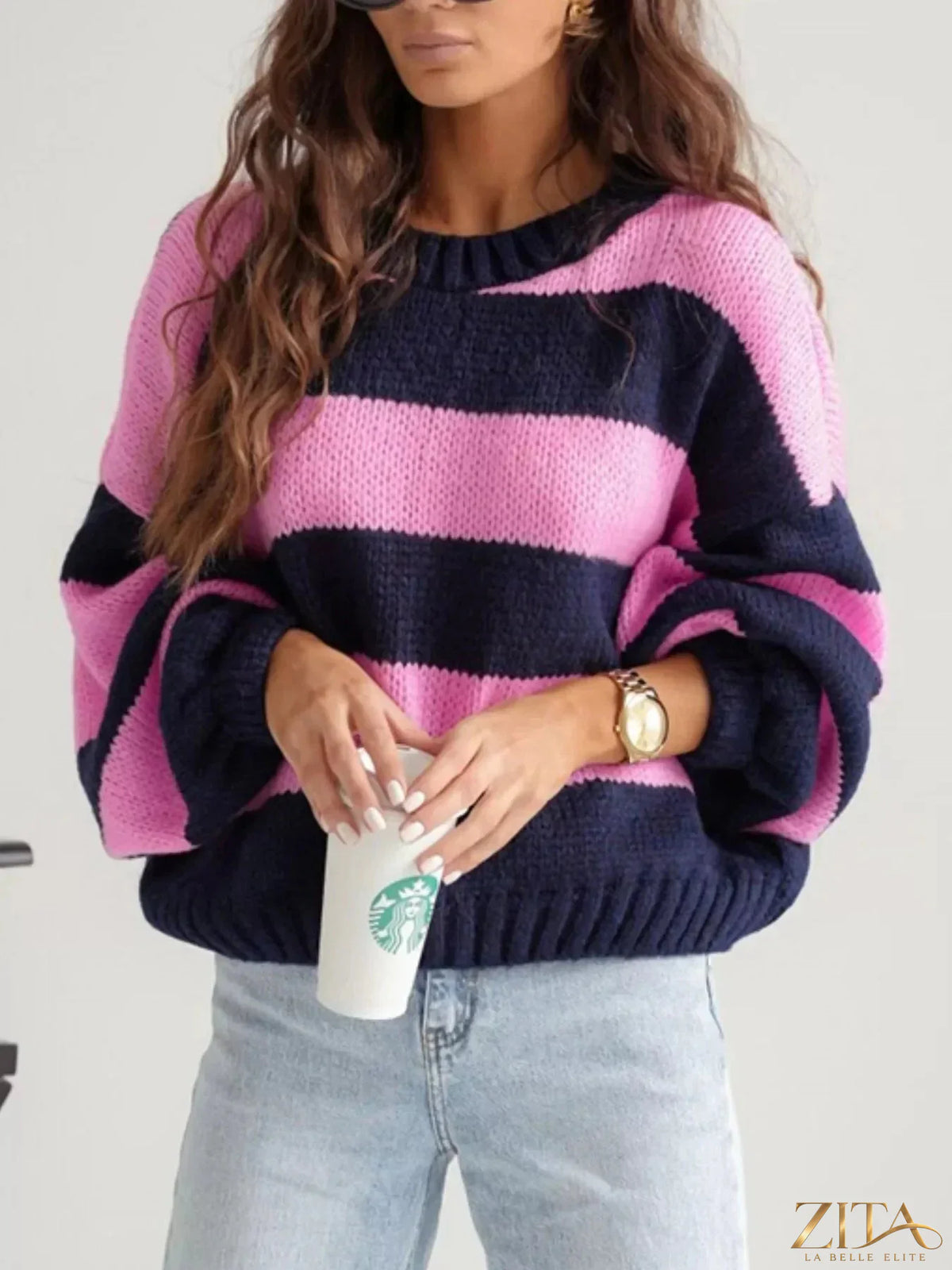 Striped dropped shoulder sweater by Trendsi featuring a cozy knit fabric and relaxed fit with bold horizontal stripes.