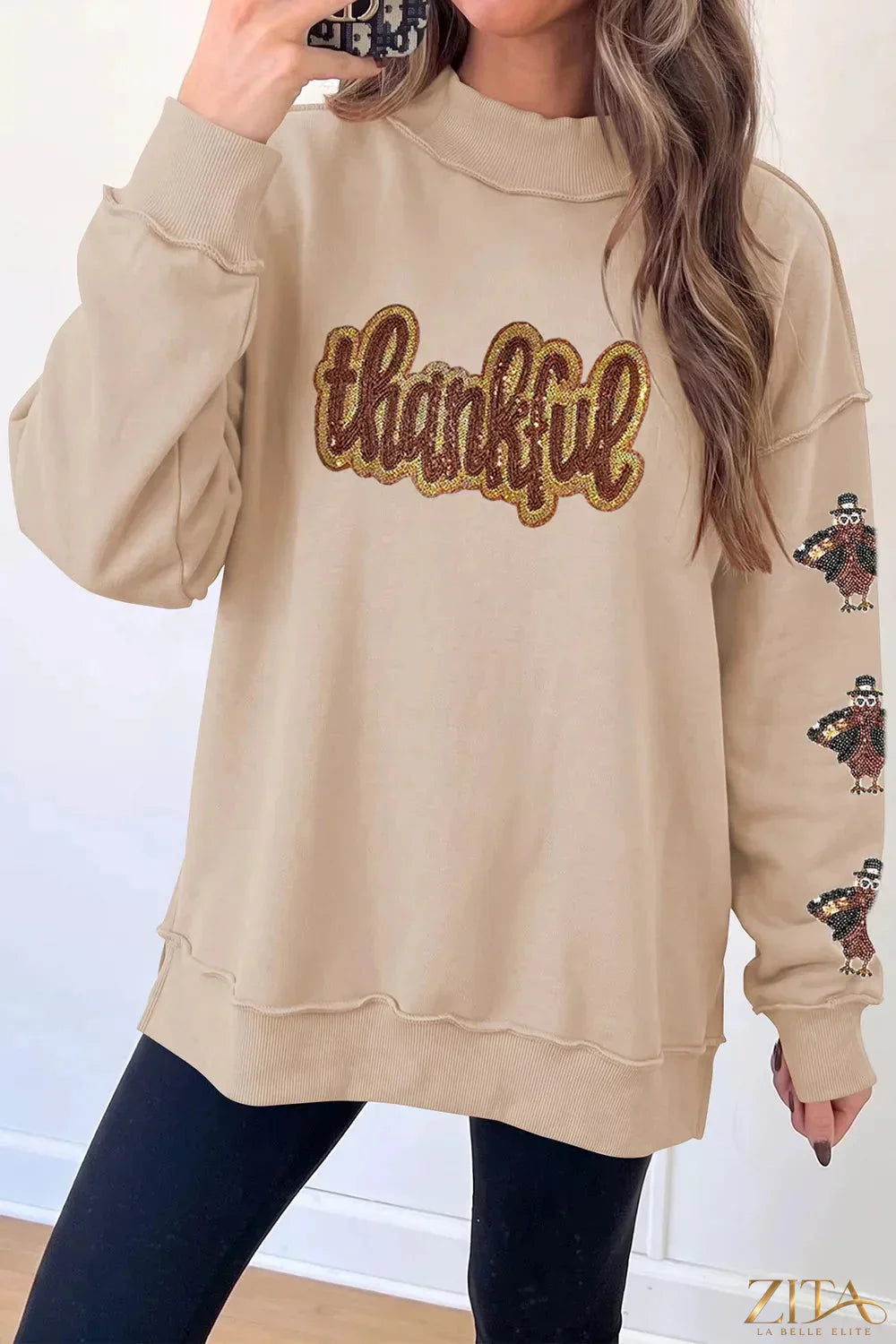 Zita La Belle Elite Thankful sequin mock neck sweatshirt with sparkling embellishments and cozy fit, front view.
