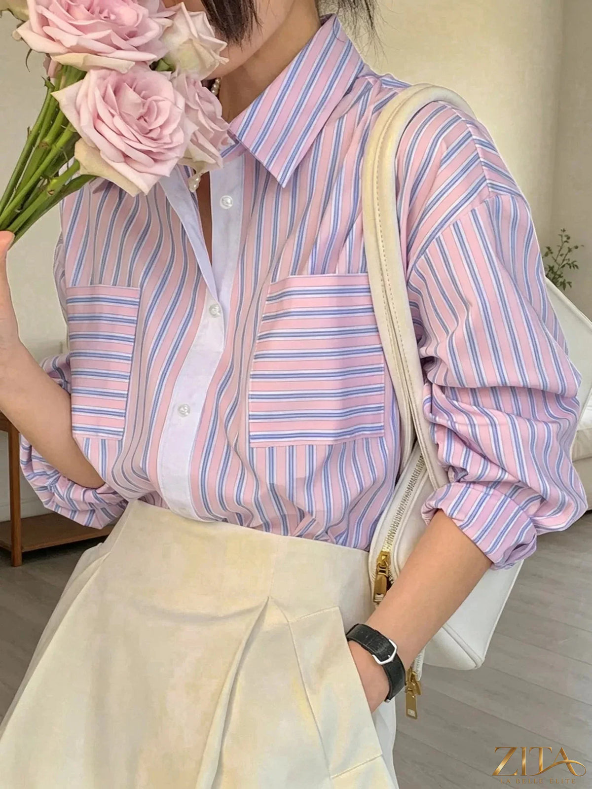 Zita La Belle Elite striped button-down shirt with blue and white vertical stripes, classic collar, and long sleeves.