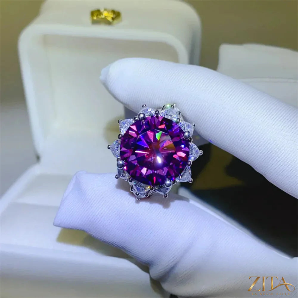 Sterling silver flower-shaped ring with a 10-carat moissanite gemstone, showcasing intricate design and sparkling brilliance.