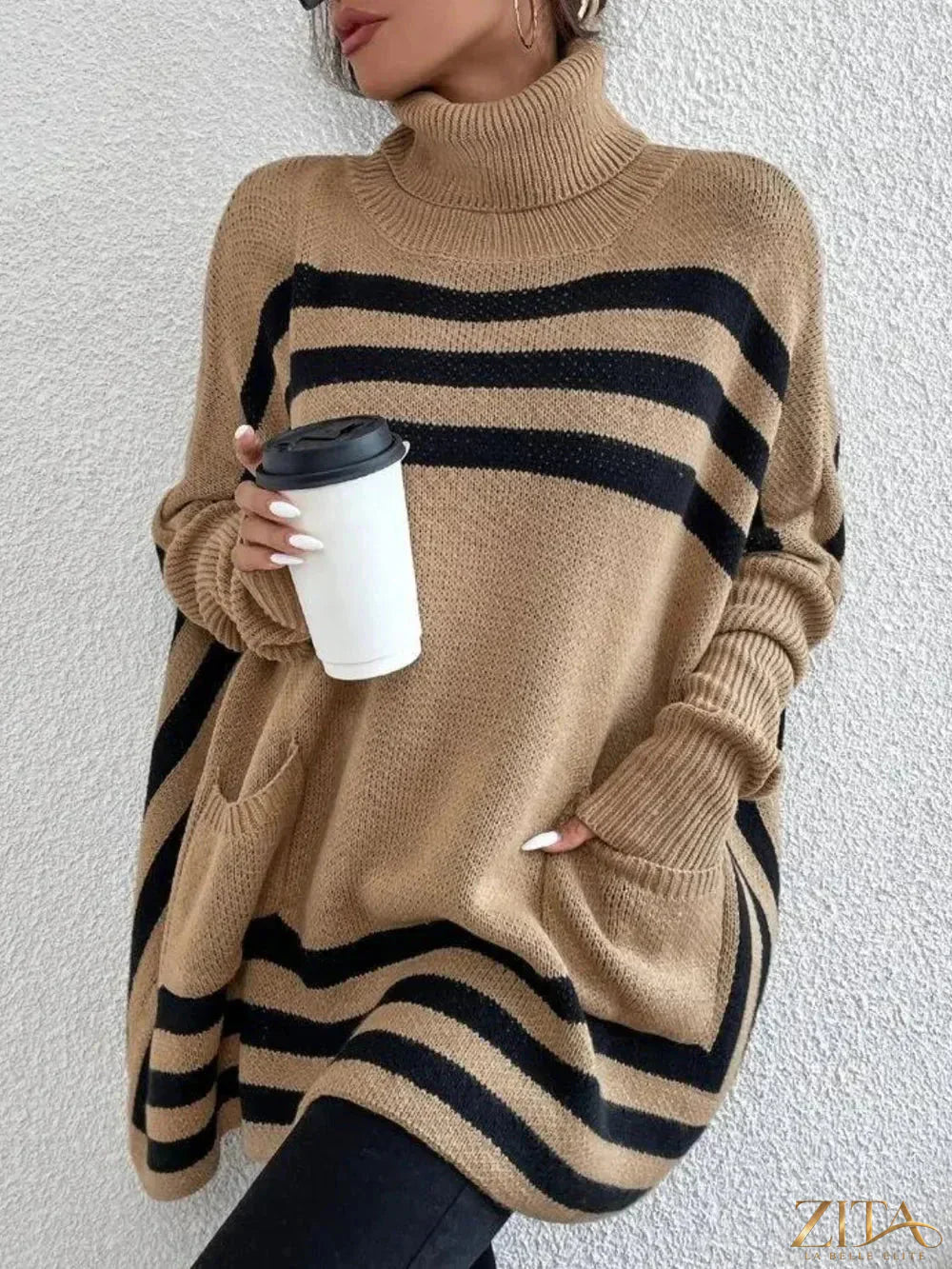 Striped turtleneck batwing sleeve sweater with pockets from Trendsi, featuring a cozy fit and stylish design in neutral tones.