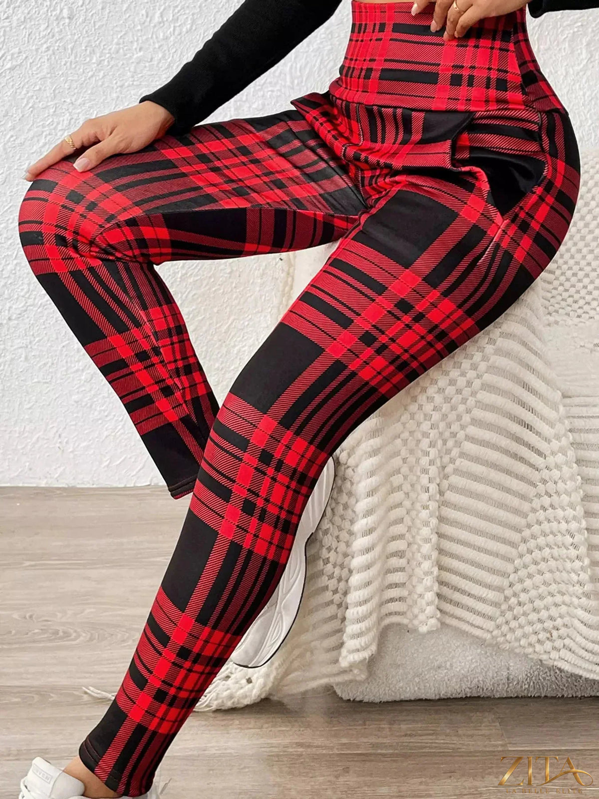 High-waisted plaid slim-fit leggings from Trendsi displayed on a model, showing the stylish pattern and comfortable fit.