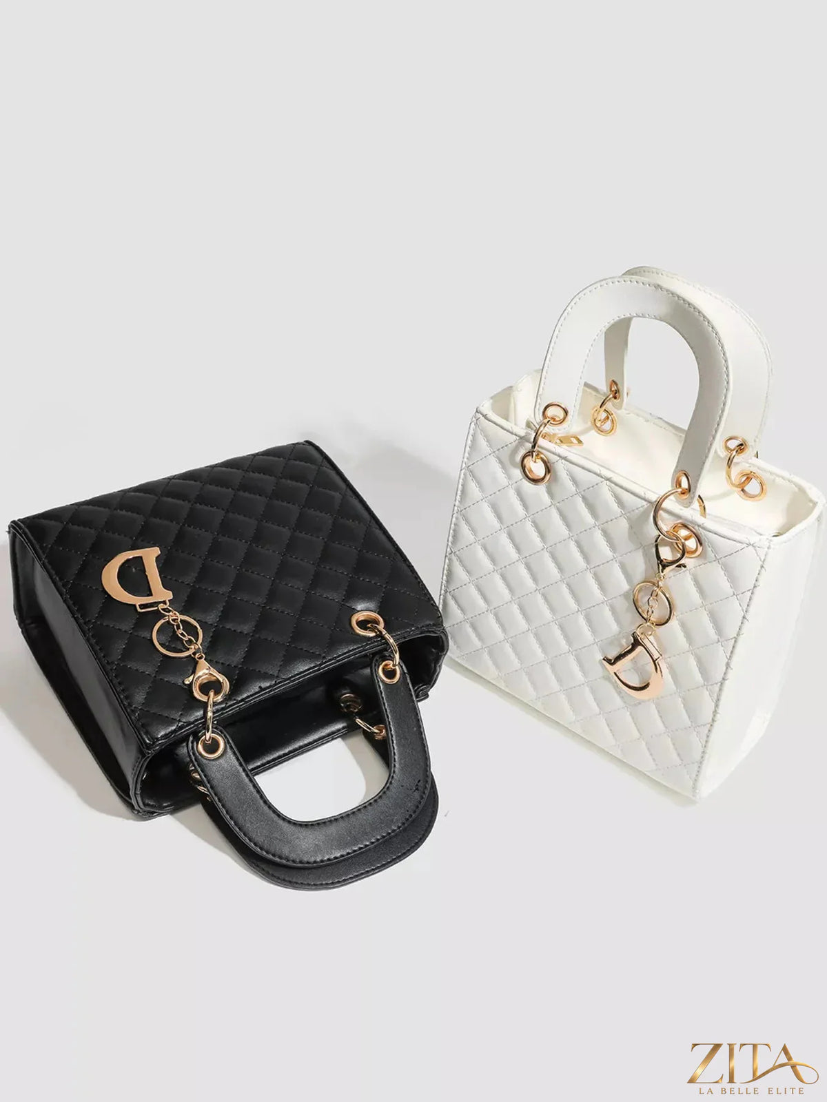 Zita La Belle Elite quilted top handle handbag with gold-tone hardware and elegant stitching, crafted from smooth leather.