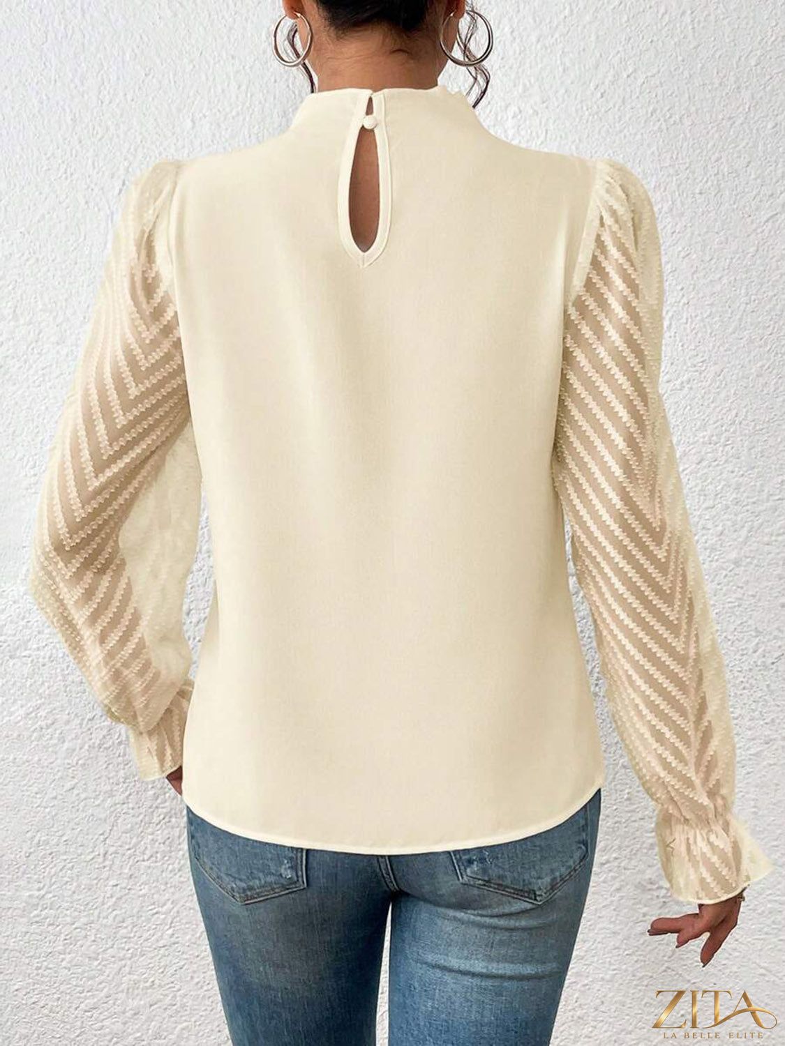 Zita La Belle Elite mock neck blouse with flounce sleeves, featuring a stylish and elegant design, shown in a close-up image.