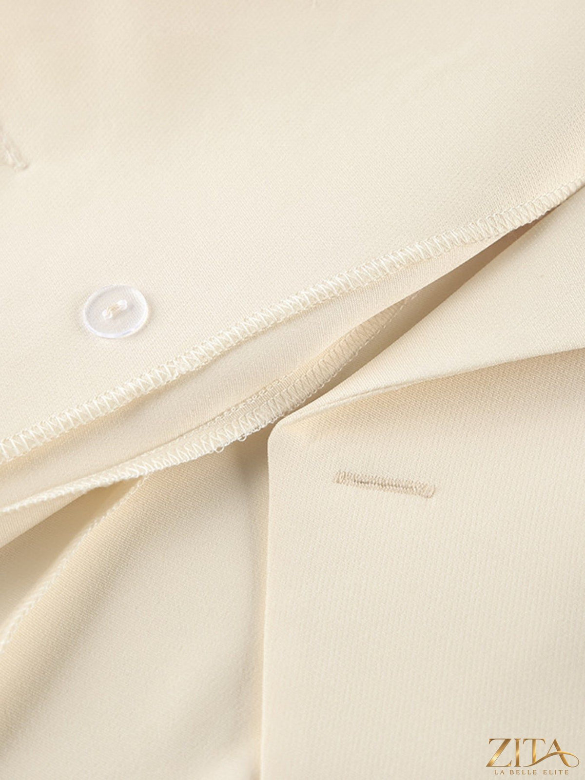 Zita La Belle Elite one-button blazer and wide-leg pants set, tailored fit, in neutral fabric, displayed on a hanger.