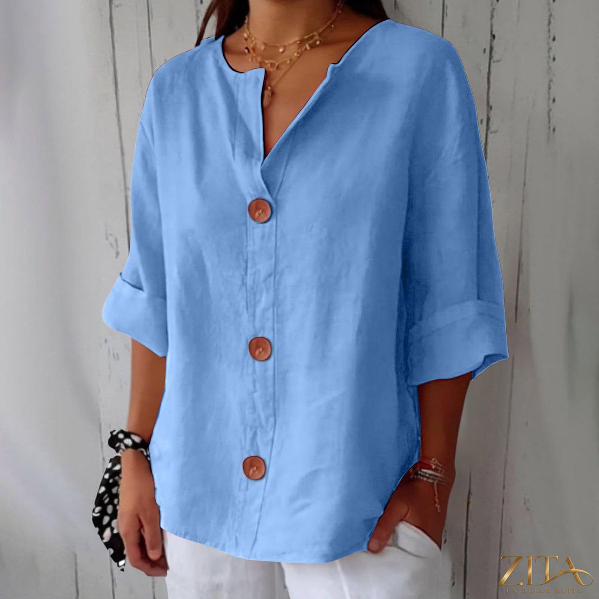 Women’s V-neck cotton linen buttoned blouse by Zita La Belle Elite, casualwear, shown in a light, breathable fabric with button details.