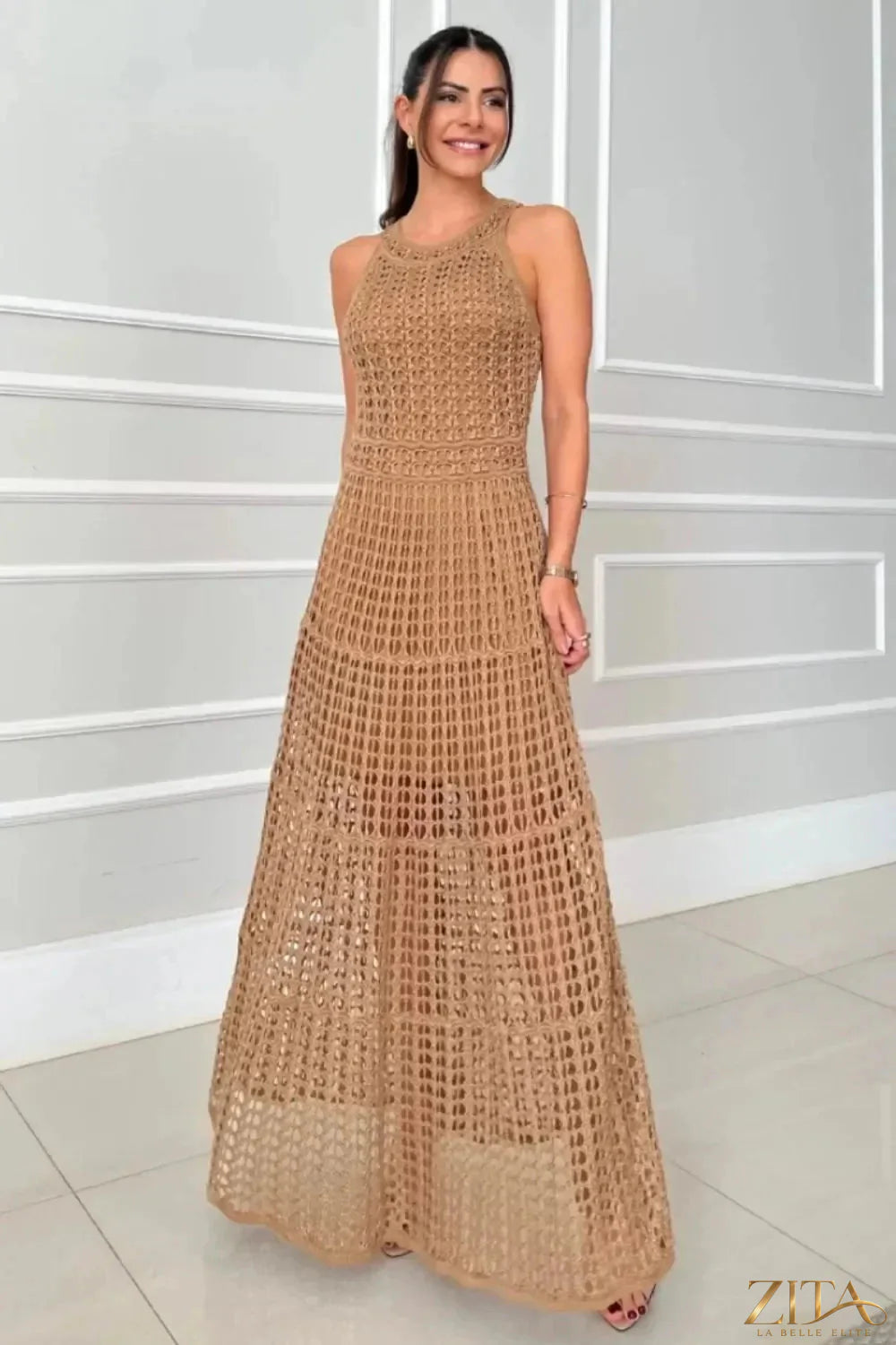 Zita La Belle Elite hollowed-out sleeveless maxi dress in flowing fabric, featuring a stylish cut-out design and elegant silhouette.