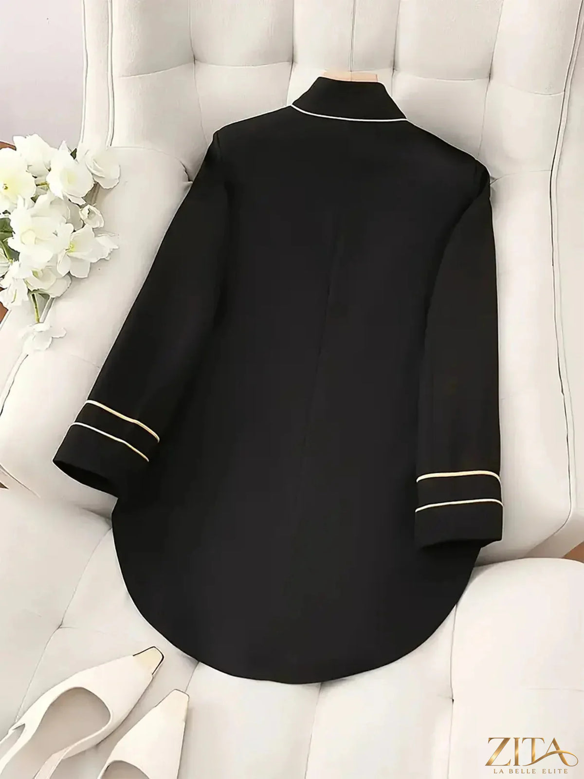 Zita La Belle Elite decorative button high-low blazer with cuff trim, showcasing a stylish tailored design and contrasting fabric details.