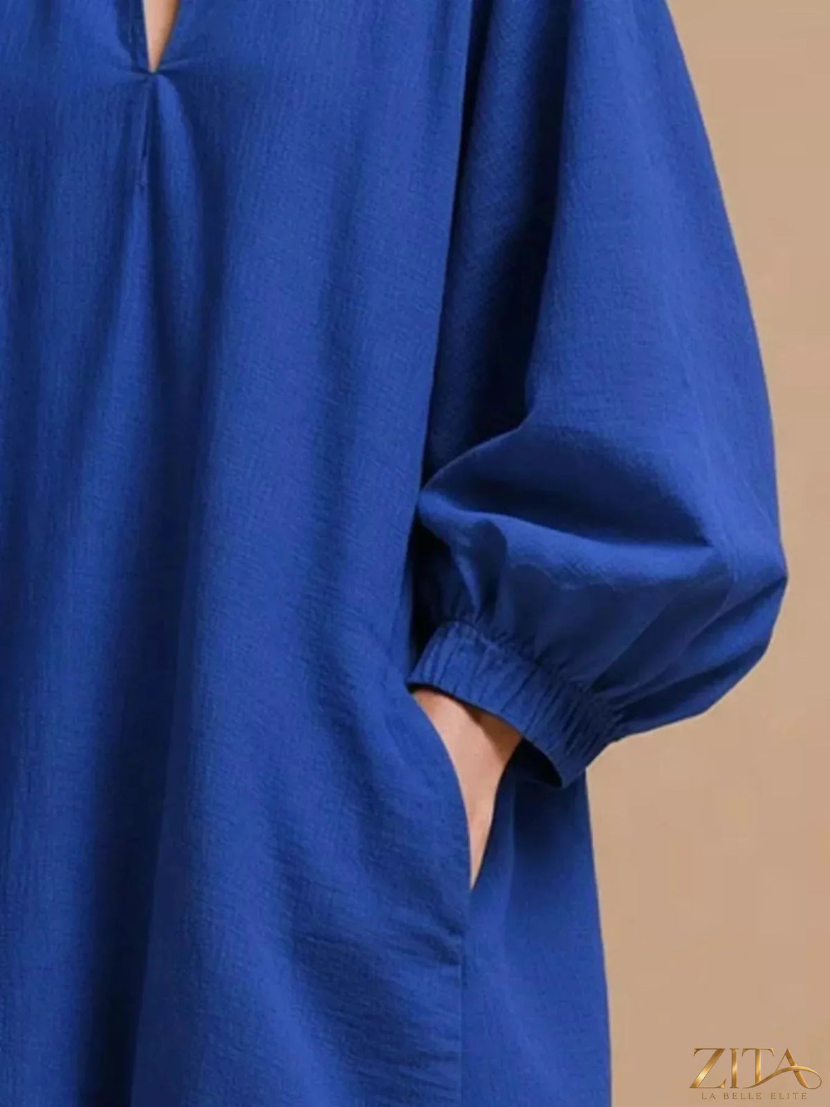 Casual loose-fit balloon sleeve mini dress with pockets by Zita La Belle Elite, shown in a relaxed fit with stylish balloon sleeves.