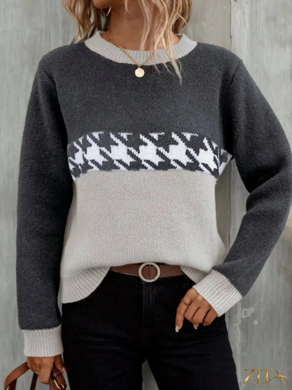 Color block houndstooth sweater by Trendsi featuring a stylish black and white pattern and cozy knit fabric.