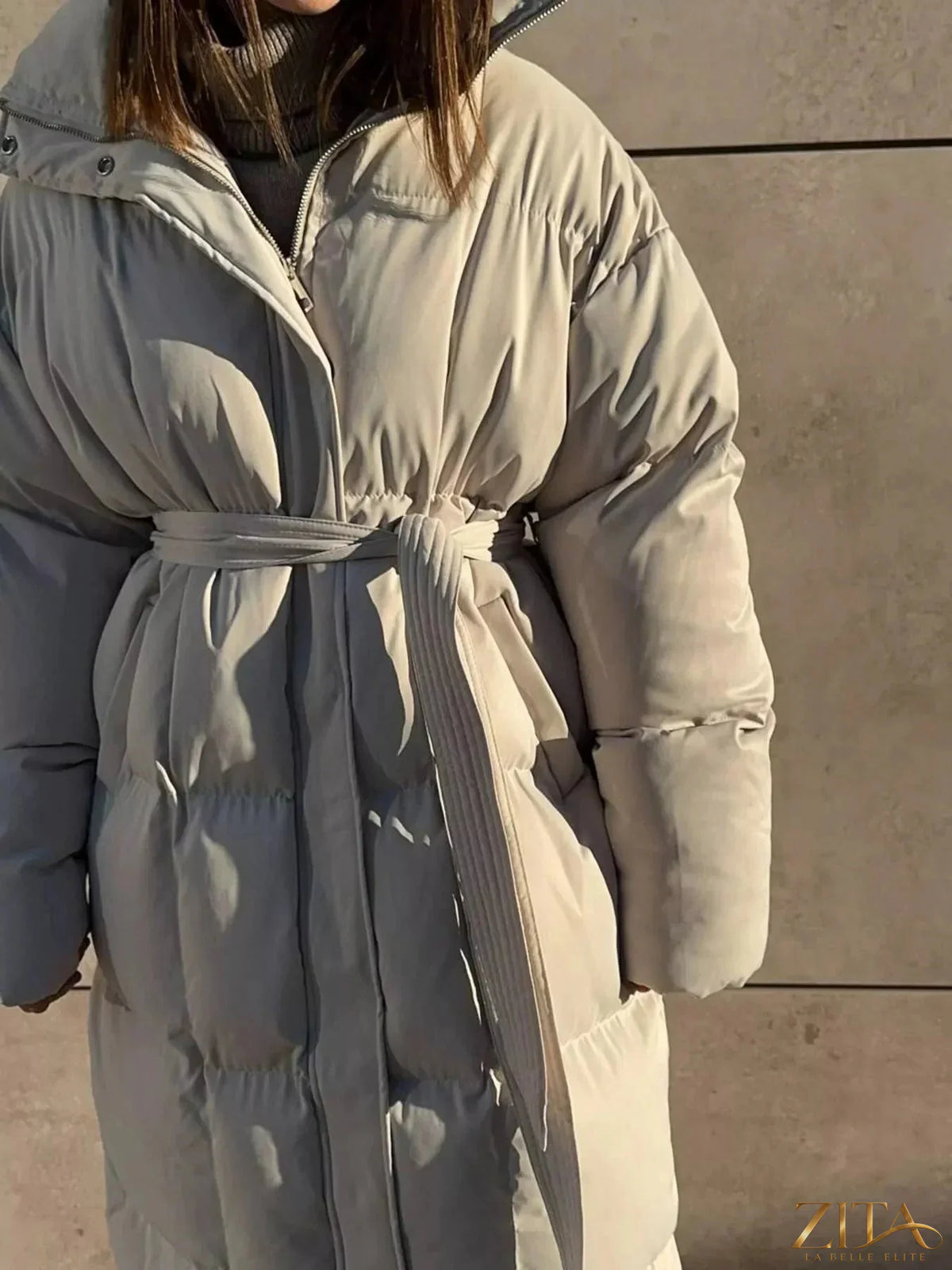 Zita La Belle Elite longline padded winter coat with belt, featuring a warm, insulated design and a stylish, tailored fit.