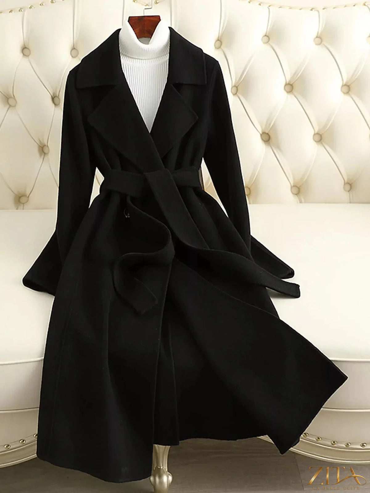 Zita La Belle Elite longline wool coat with waist-defining belt, featuring classic tailored design and neutral color for versatile styling.