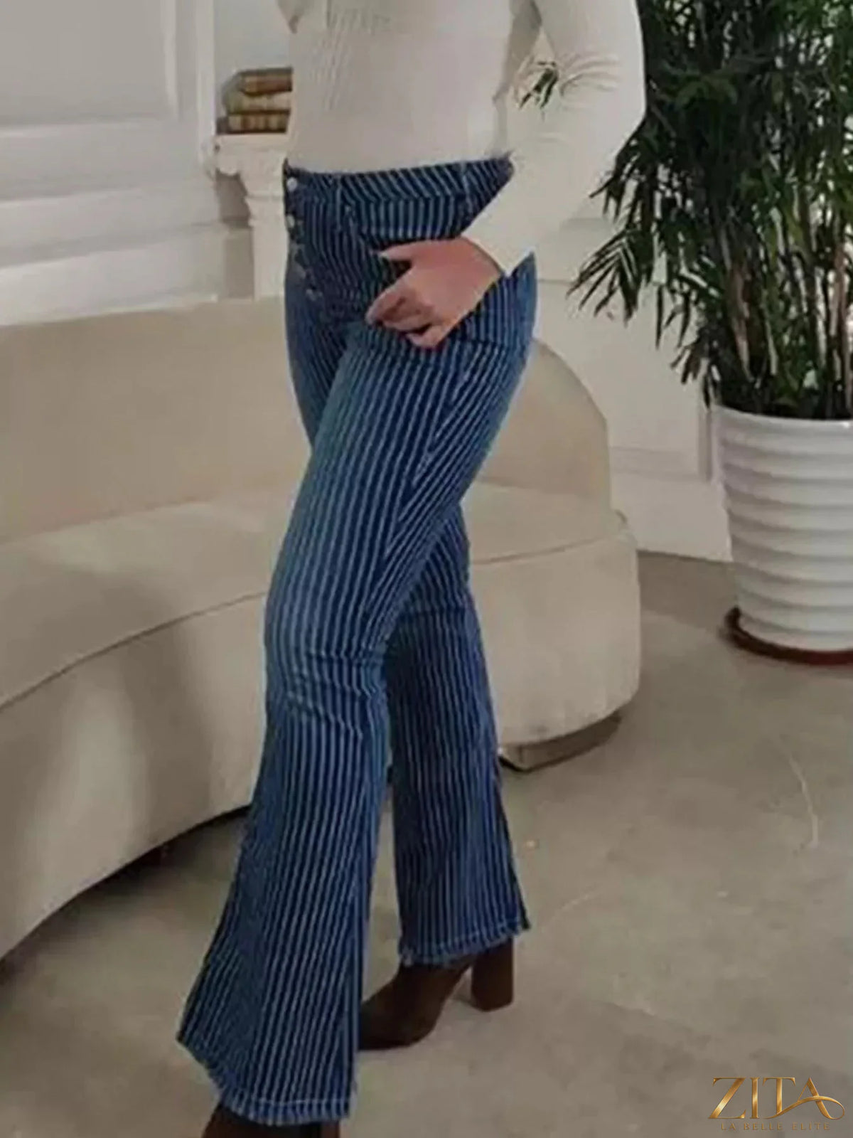 Striped button fly flare jeans by Zita La Belle Elite, showcasing high-waisted design with colorful vertical stripes and flared legs.