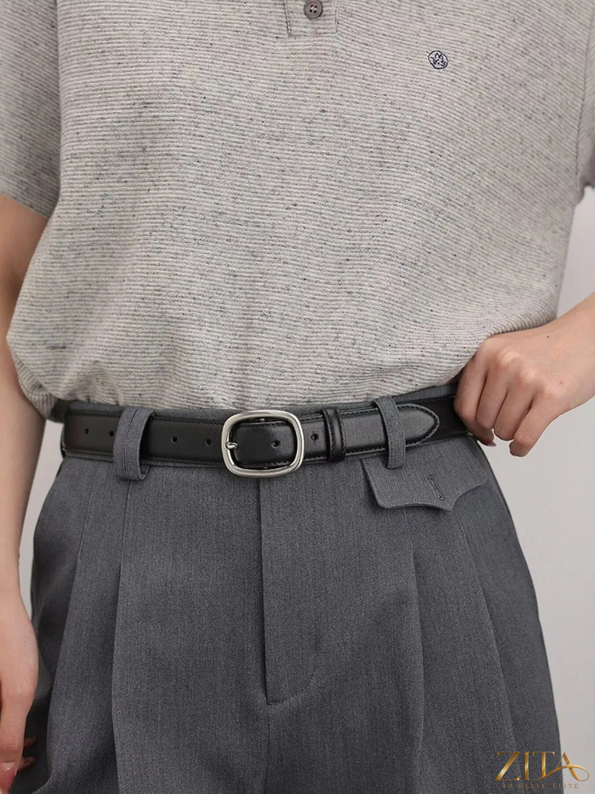 Leather belt with oval buckle by Trendsi, featuring a smooth leather strap and polished metal buckle for casual or formal wear.