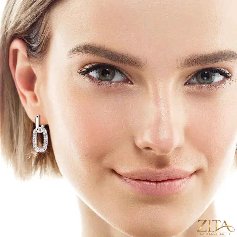 Sterling silver earrings with 2.16 carat moissanite gemstones from Zita La Belle Elite, showcasing sparkling, elegant jewelry design.