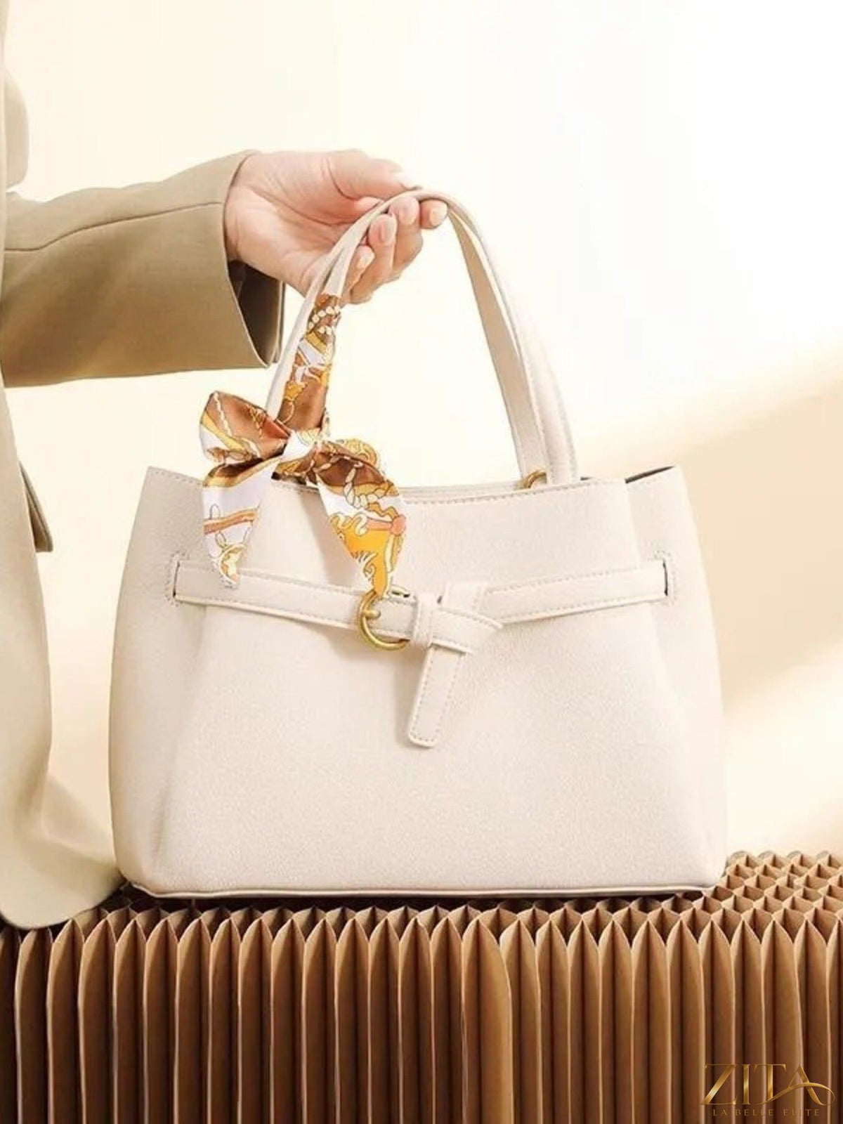 Leather top handle handbag by Zita La Belle Elite, showcasing its elegant design and durable leather material.