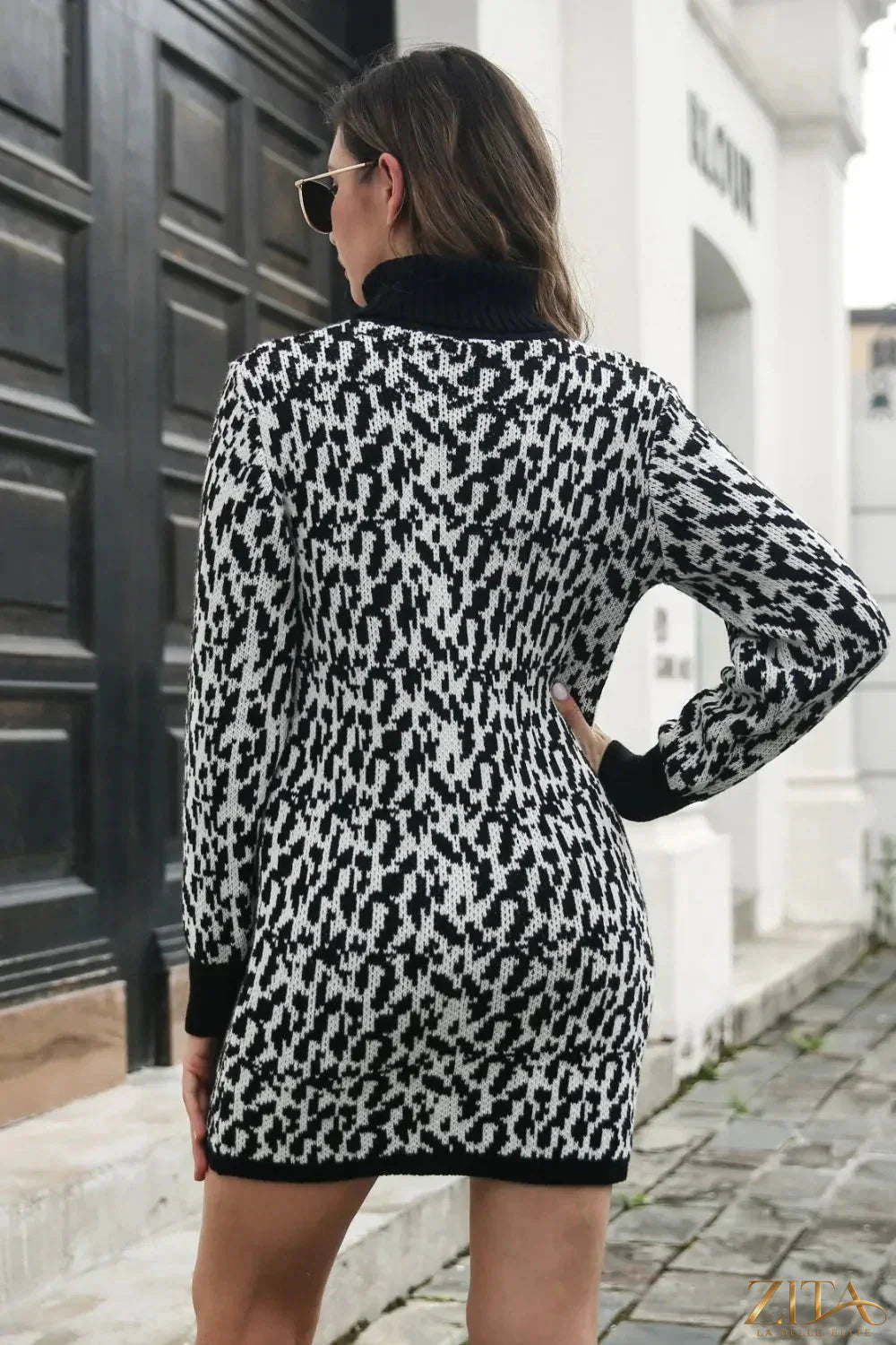Heathered turtleneck mini sweater dress by Trendsi, featuring a cozy knit fabric and fitted silhouette for stylish winter wear.