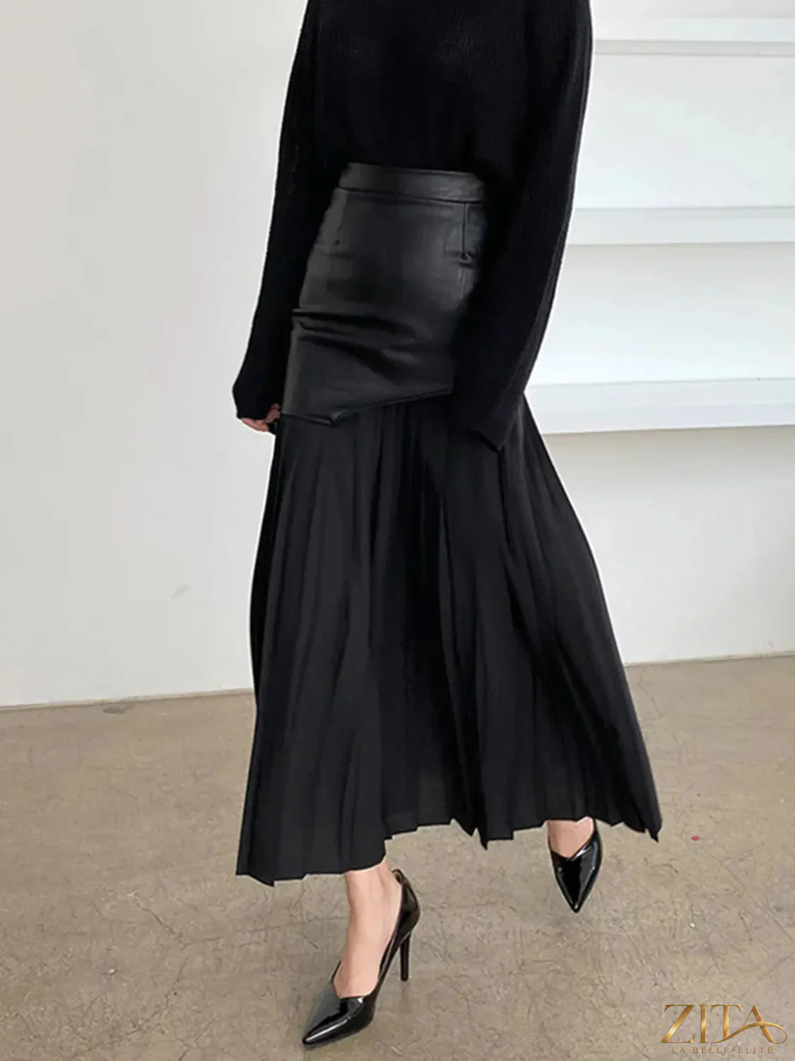 Patchwork contrast pleated skirt from Trendsi featuring multicolored fabric panels and a high-waisted, flowing design.