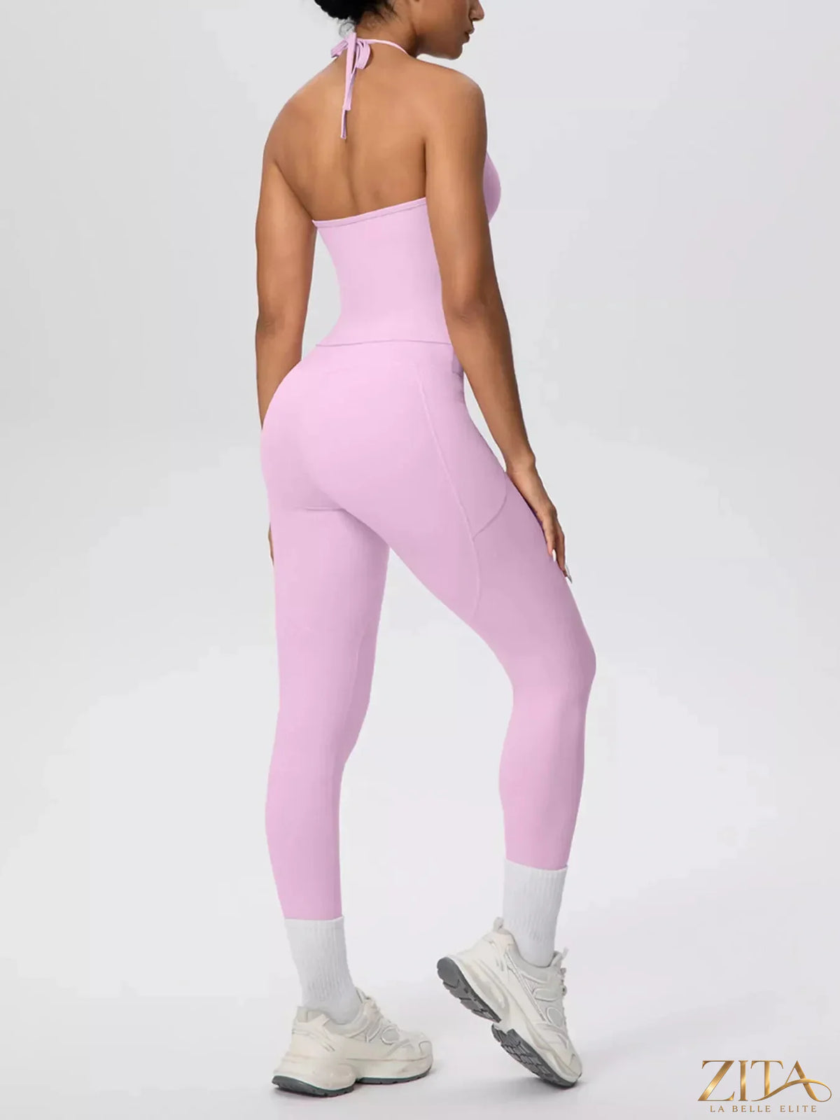 Zita La Belle Elite halter neck cami and high-waisted leggings active set, shown on a model in a workout pose.