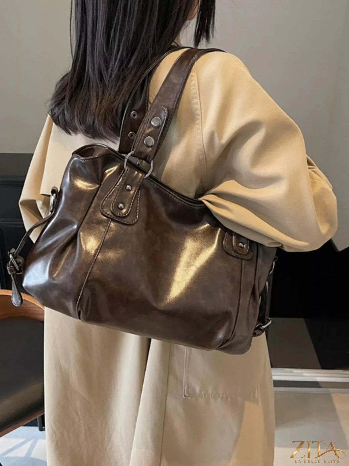 Vintage style leather handbag by Trendsi featuring a classic design with sturdy handles and a spacious interior.