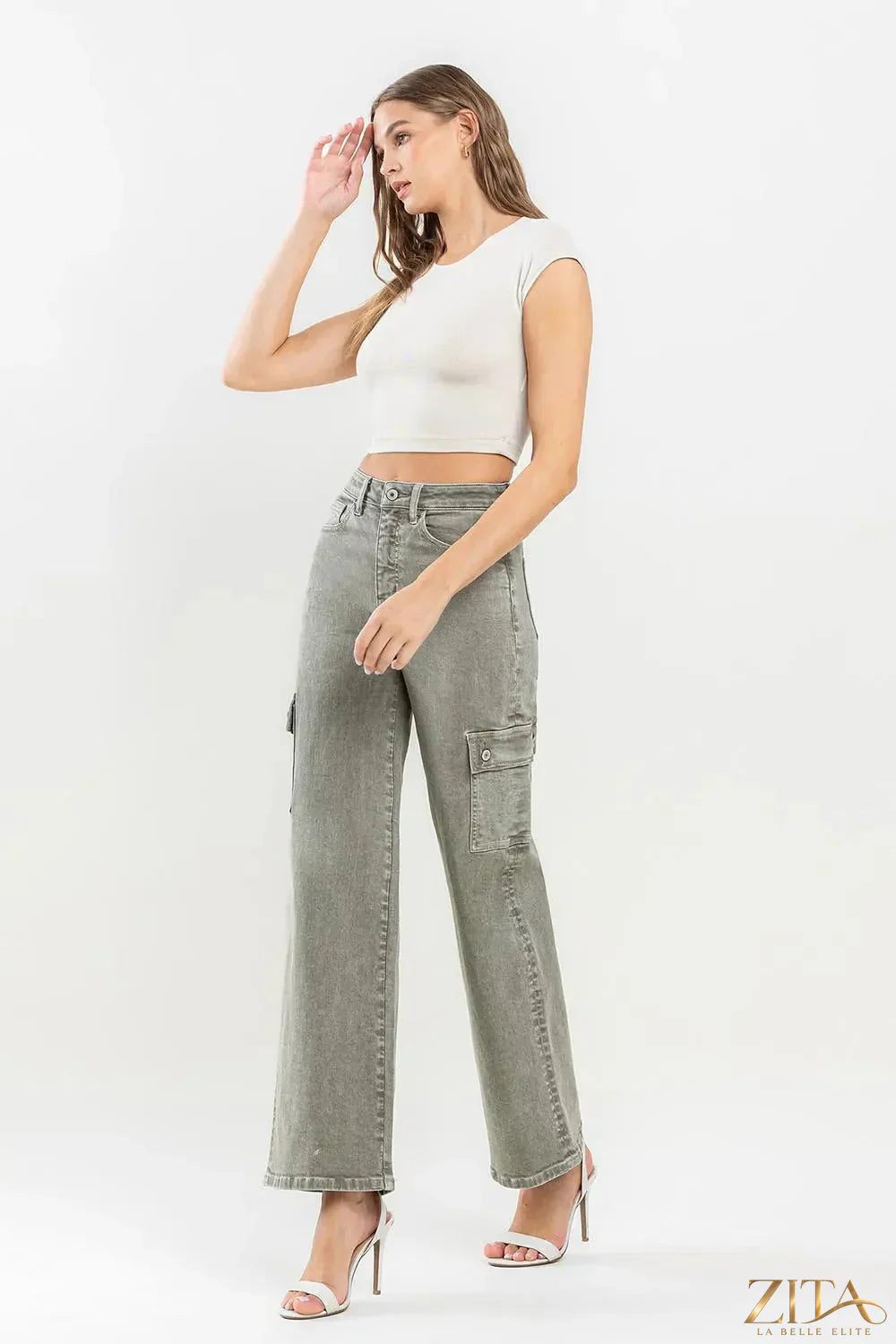 Vervet by Flying Monkey 90's super high-rise cargo jeans with multiple pockets and relaxed fit, worn by a model in a casual setting.