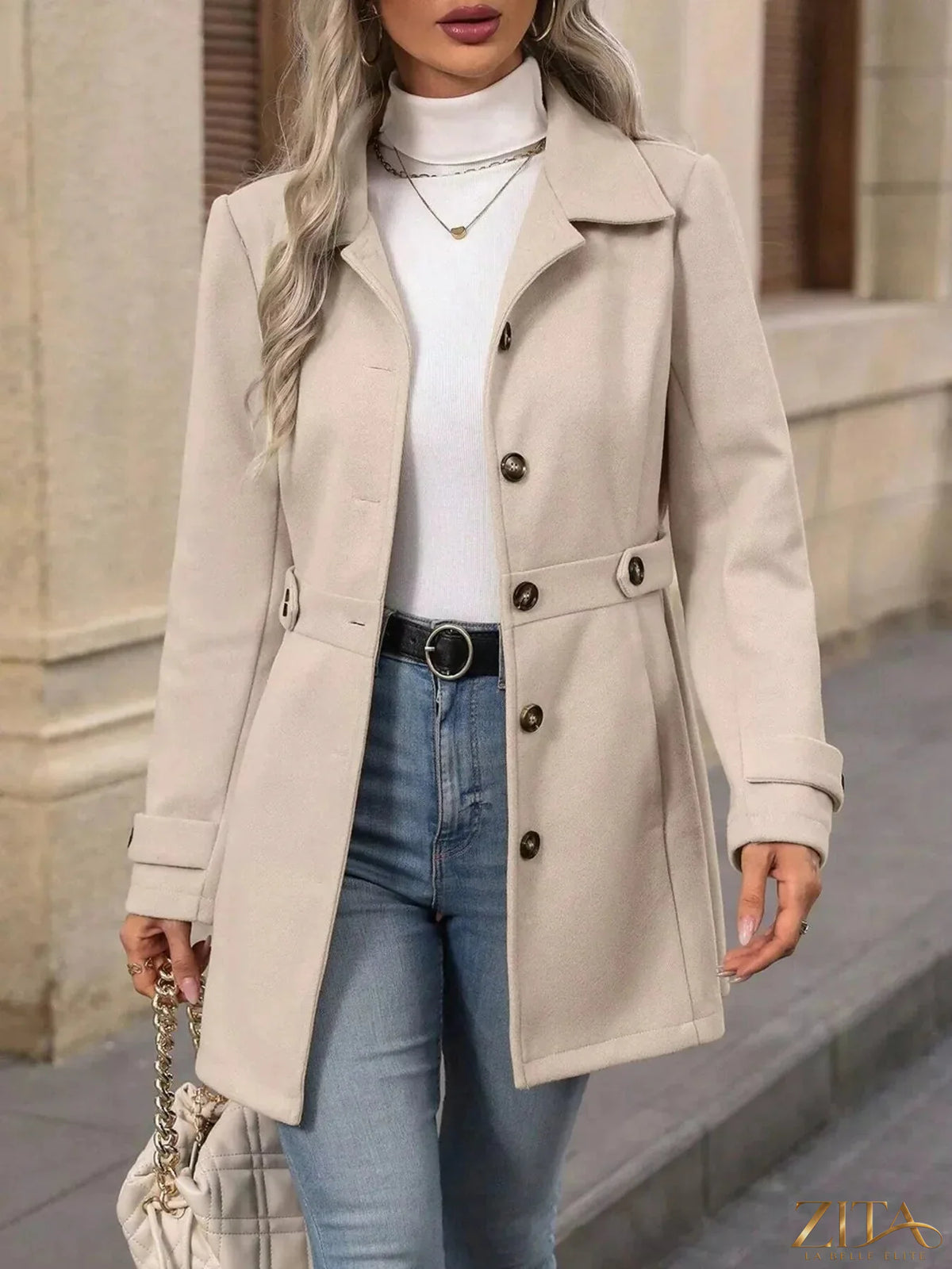 Zita La Belle Elite single-breasted long sleeve coat in neutral fabric, tailored with a classic lapel collar and sleek silhouette.