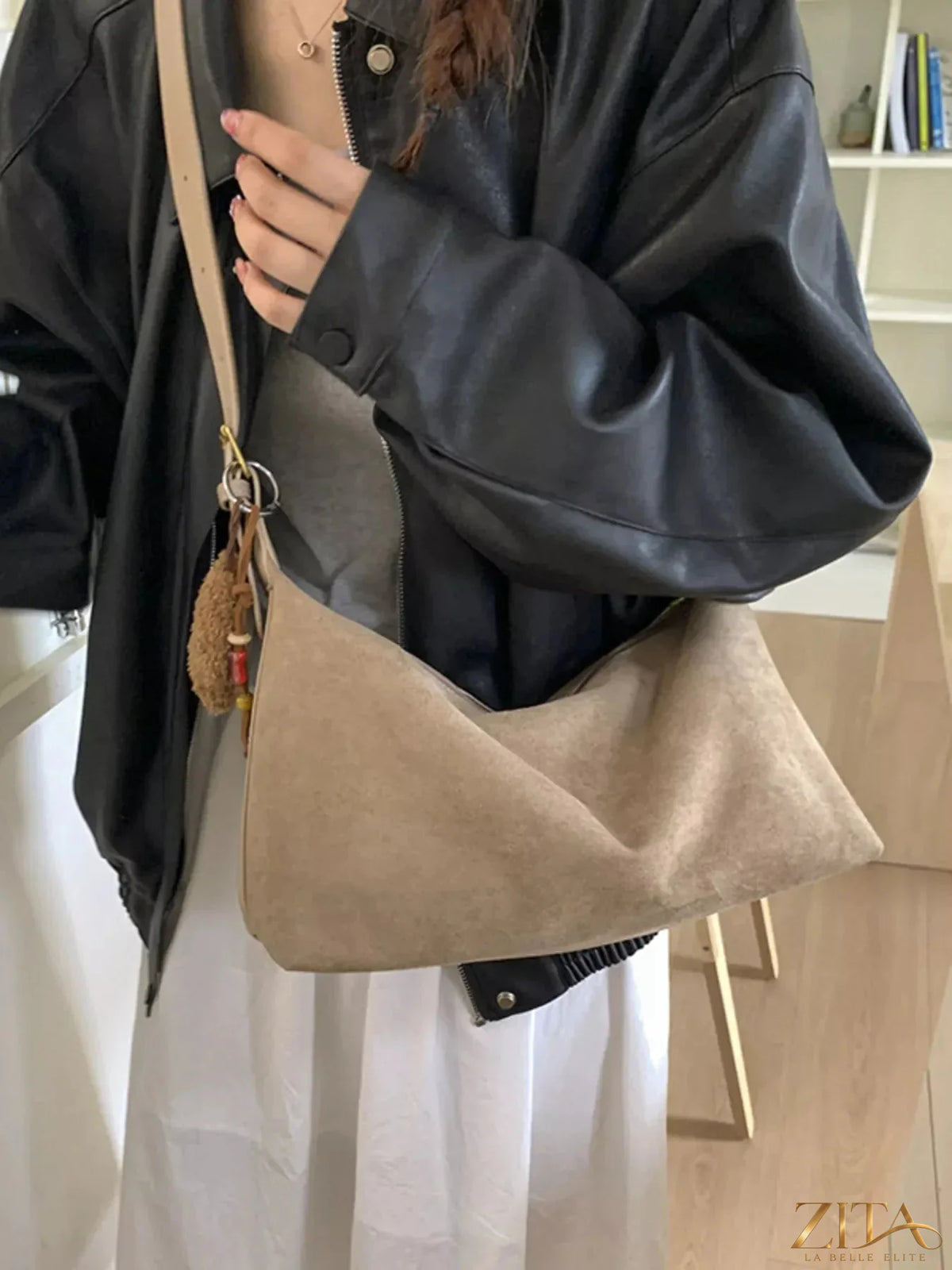 Zita La Belle Elite solid color suede hobo crossbody bag with a soft, textured finish and a spacious interior.