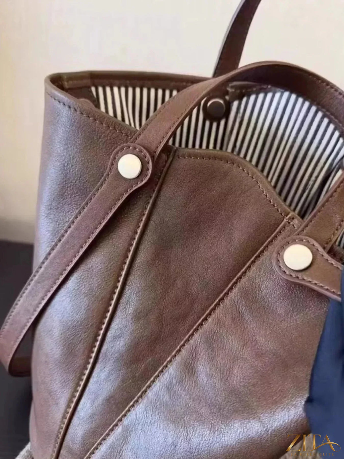 Zita La Belle Elite leather bucket tote bag with sturdy handles and spacious interior, stylish accessory for everyday use.