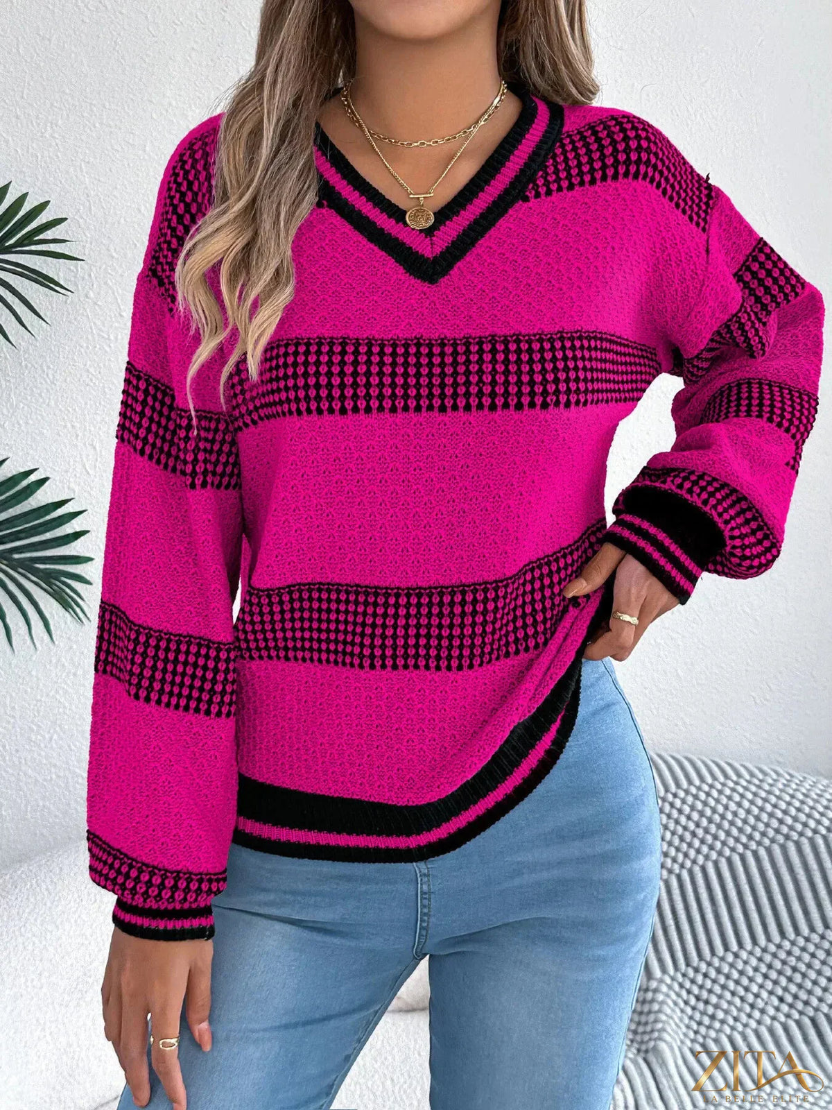 Contrast striped V-neck sweater from Trendsi featuring a stylish pattern and comfortable fit in soft fabric.