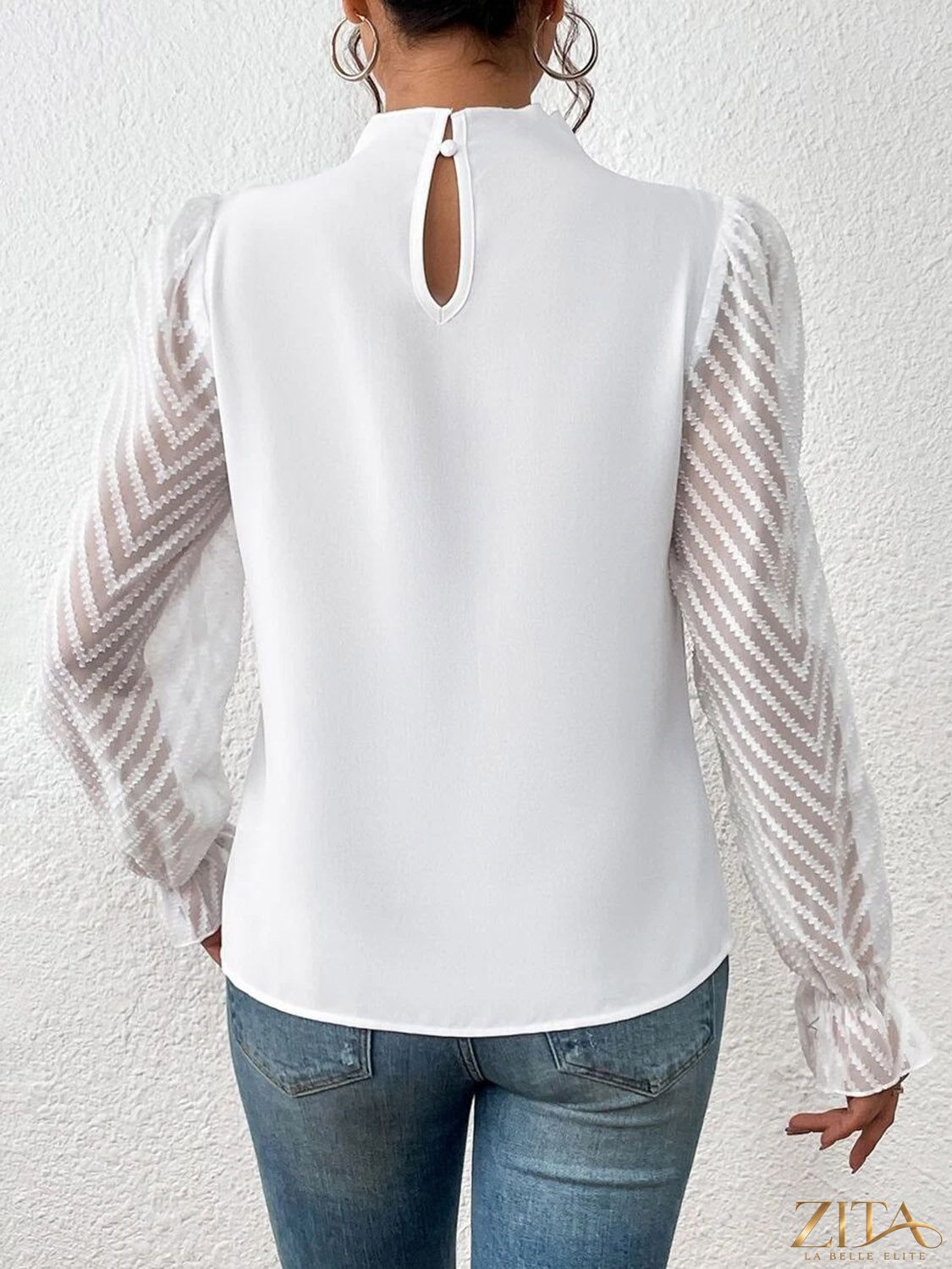 Zita La Belle Elite mock neck blouse with flounce sleeves, featuring a stylish and elegant design in soft fabric.