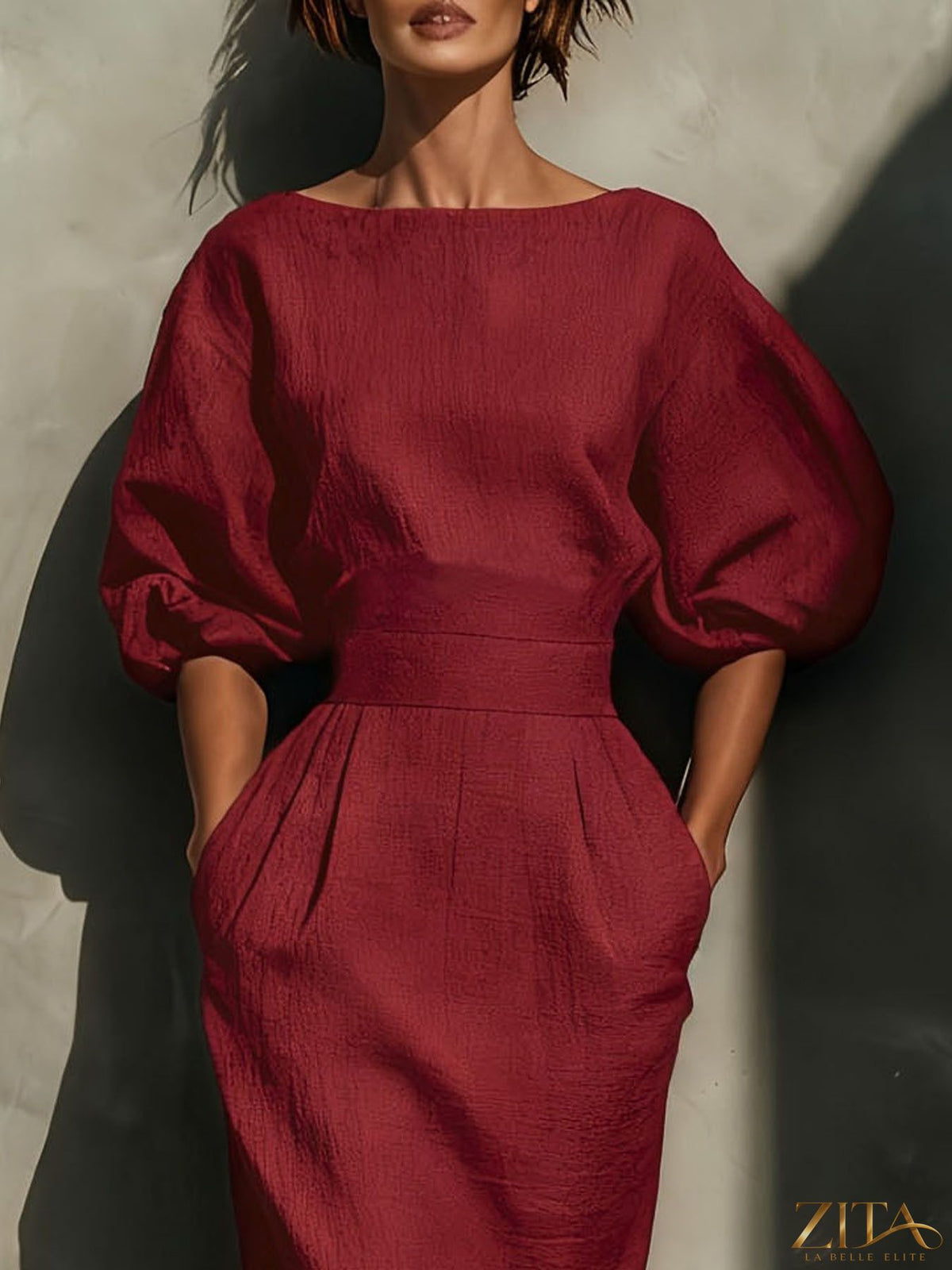 Zita La Belle Elite round neck midi dress with puff sleeves, showcasing a stylish, fitted silhouette in a vibrant fabric.