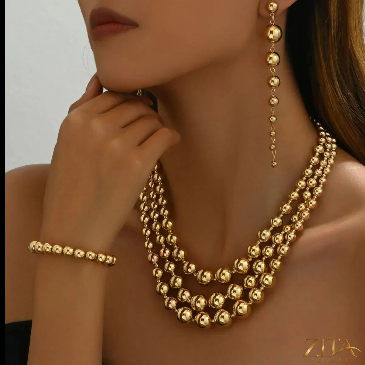 18K gold-plated layered beaded jewelry set with multiple strands and delicate bead details by Zita La Belle Elite