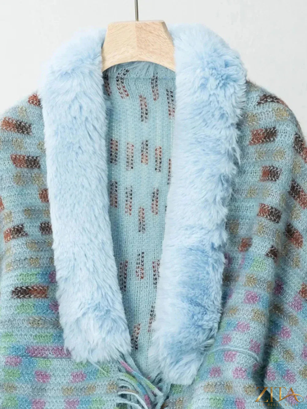 Fuzzy open front fringe poncho from Trendsi with a cozy, textured design and fringe details, perfect for layered fall outfits.