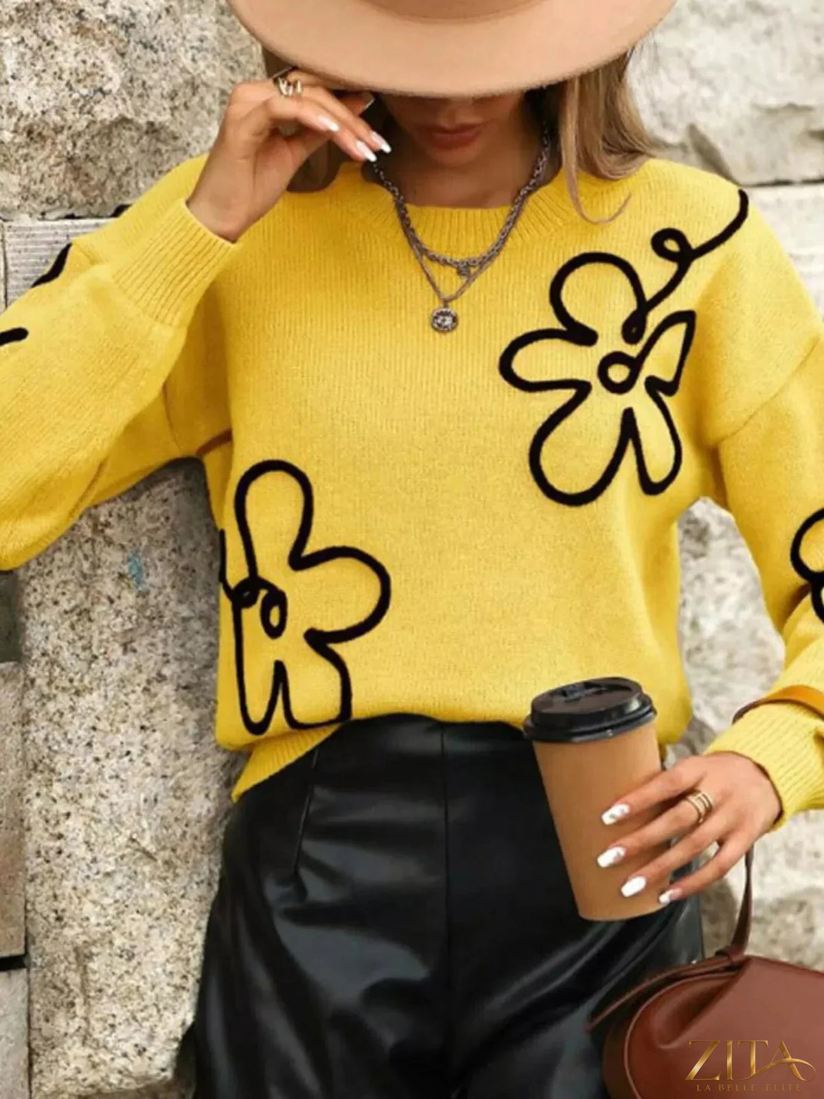 Flower dropped shoulder sweater by Trendsi, featuring a soft knit fabric, floral design, and relaxed fit with dropped shoulder sleeves.