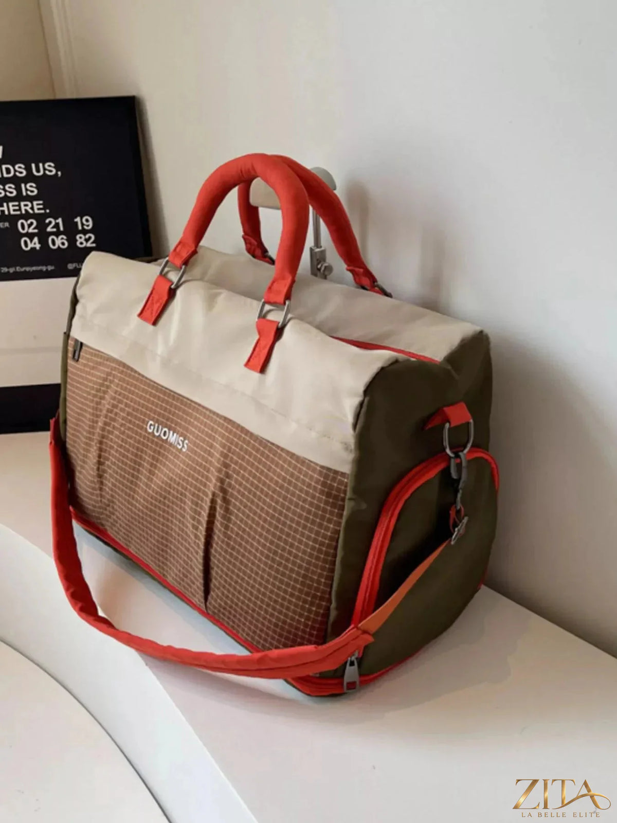 Zita La Belle Elite plaid travel bag with detachable strap, featuring a stylish checkered pattern and zipper closure.