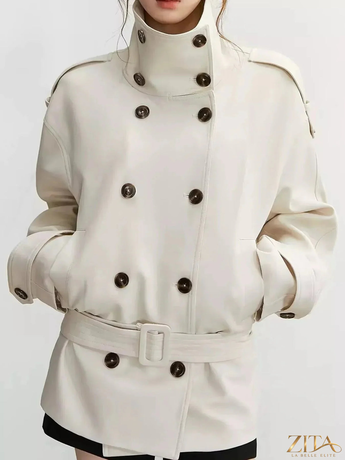 Zita La Belle Elite double-breasted turtleneck trench coat in neutral fabric, shown on a hanger against a plain background.